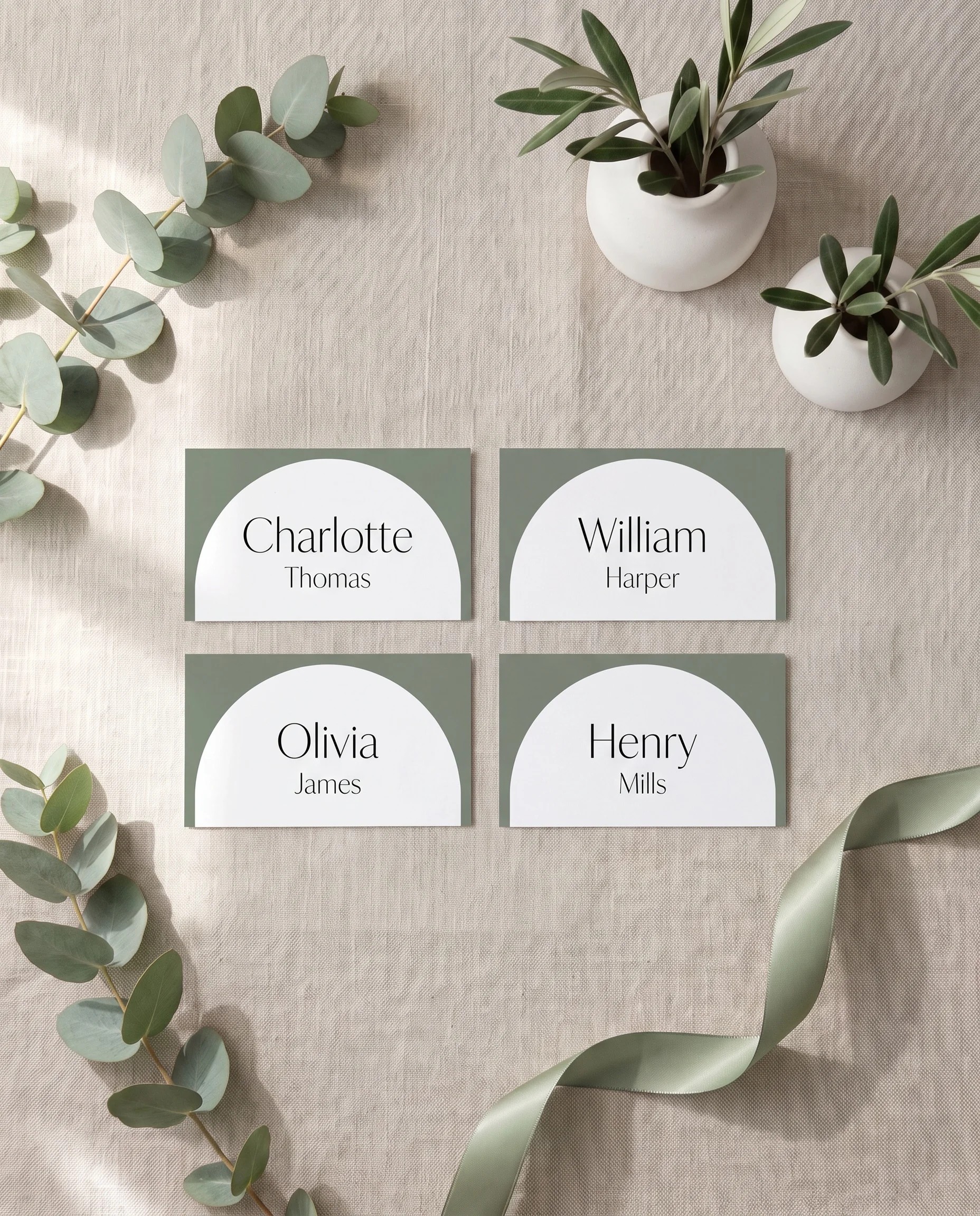 Arc Vale wedding place cards — several place cards shown flat under soft natural light at a slight overhead angle, wedding place cards.