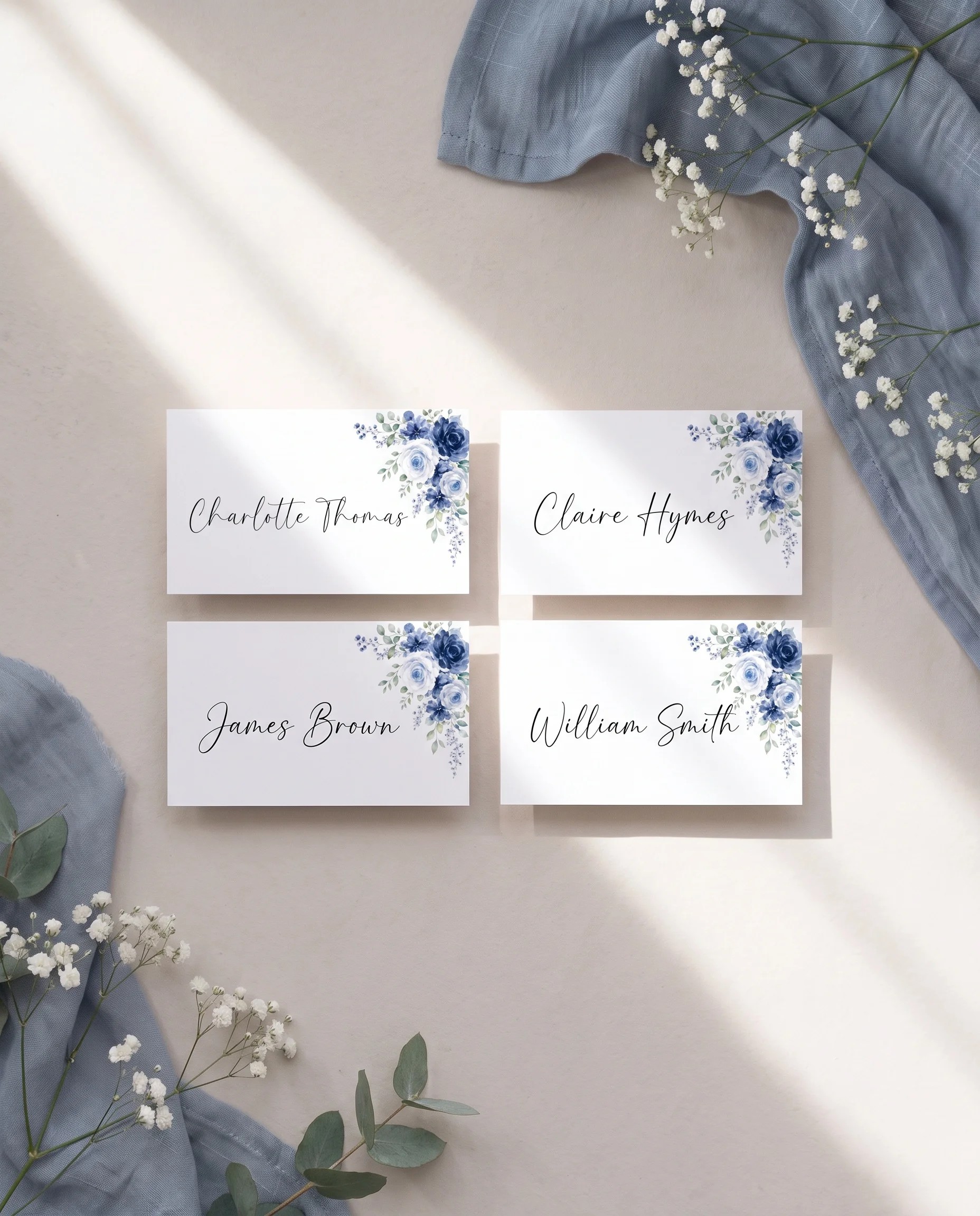 Bluebloom wedding place cards — several cards shown flat under soft natural light with an overhead angle, wedding place cards