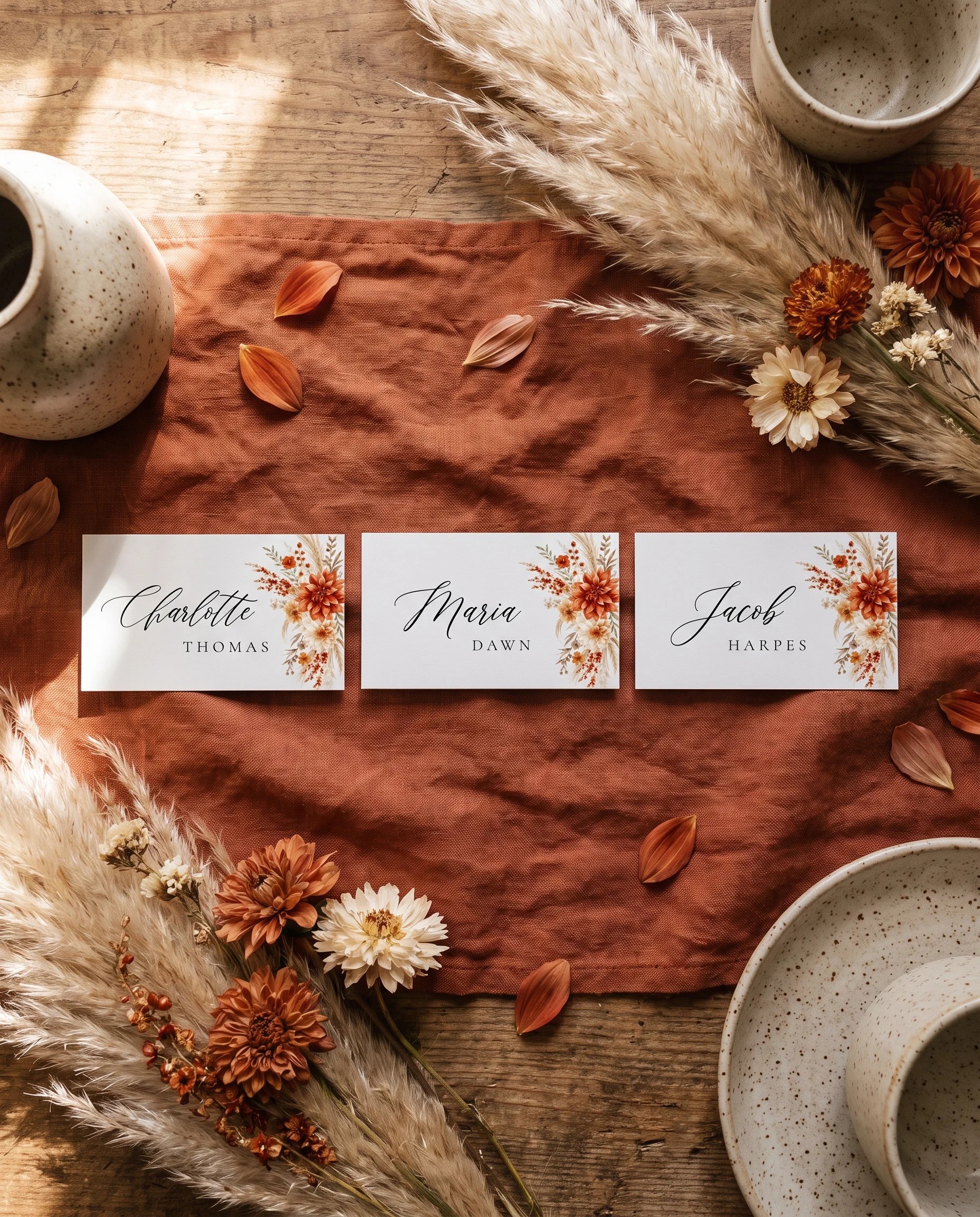 Dahlia Ember wedding place cards — several place cards shown flat under soft overhead light, wedding place cards.