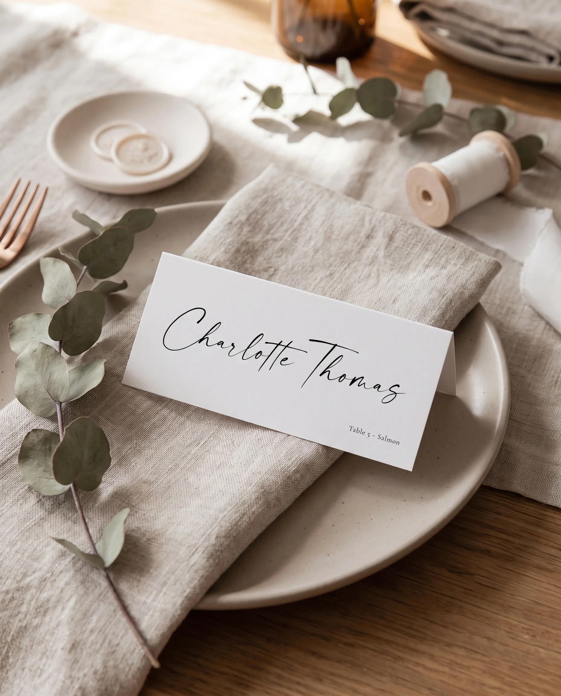 Arcadia wedding place cards — single place card shown at a set place setting with soft natural light, wedding name cards.