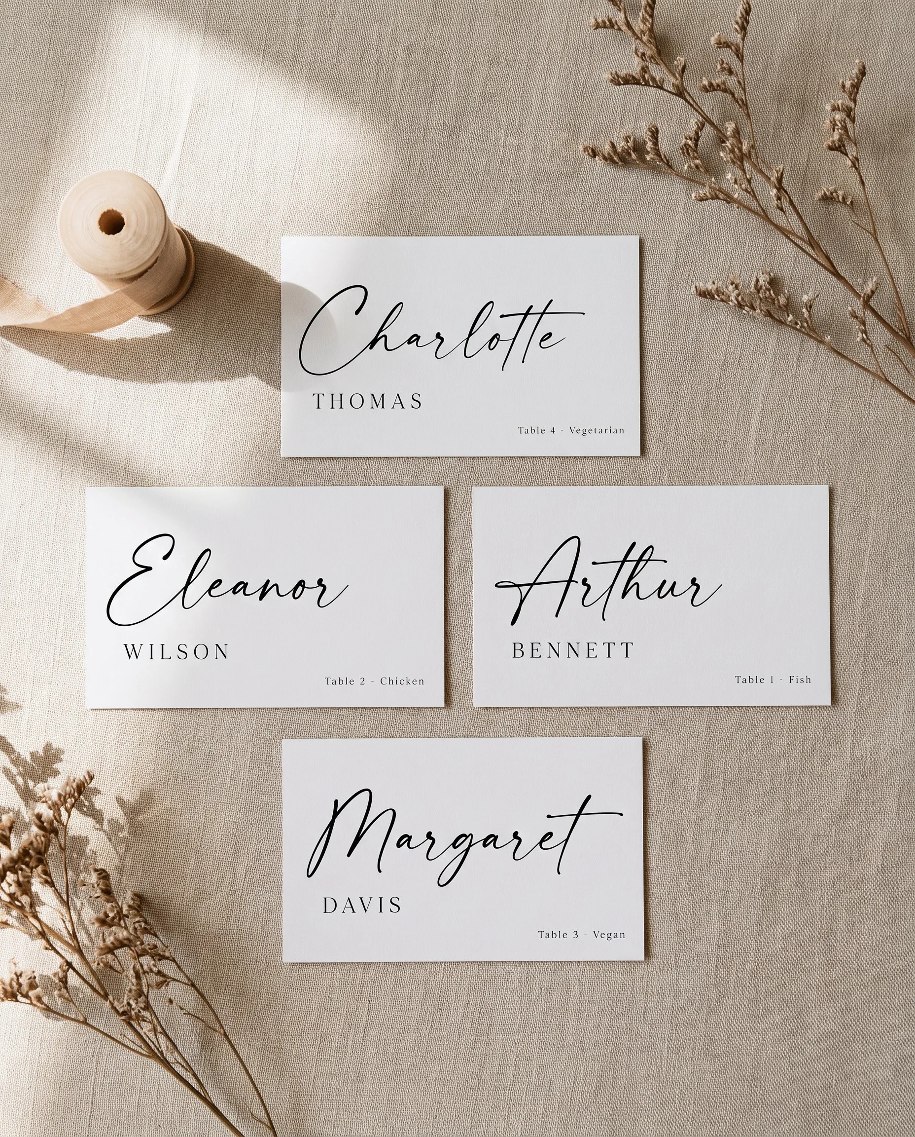 Charline wedding place cards — flat lay view of several place cards shown flat under soft natural light, wedding place cards