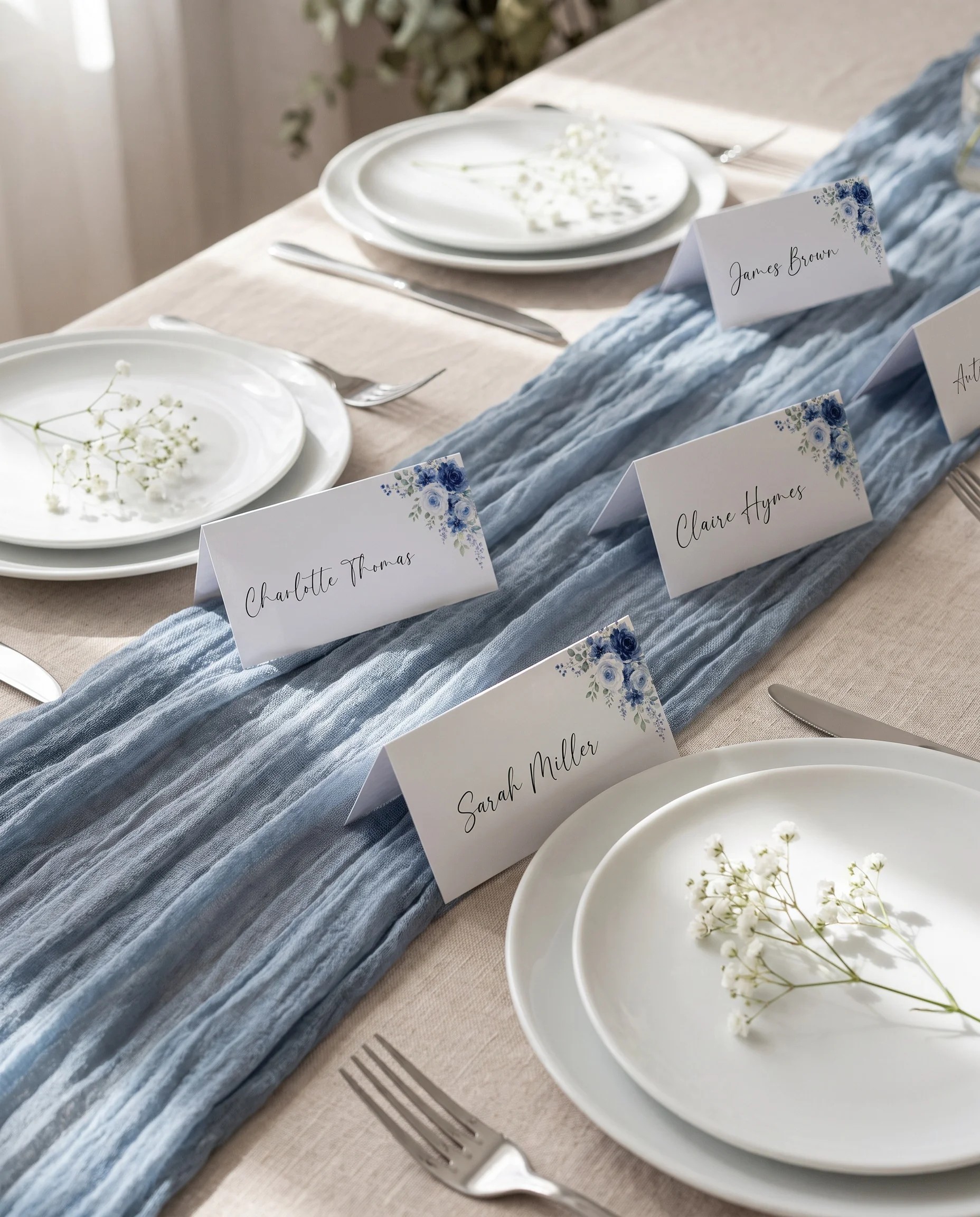 Bluebloom wedding place cards — arranged on a dressed reception table under soft natural light, elegant place card template.