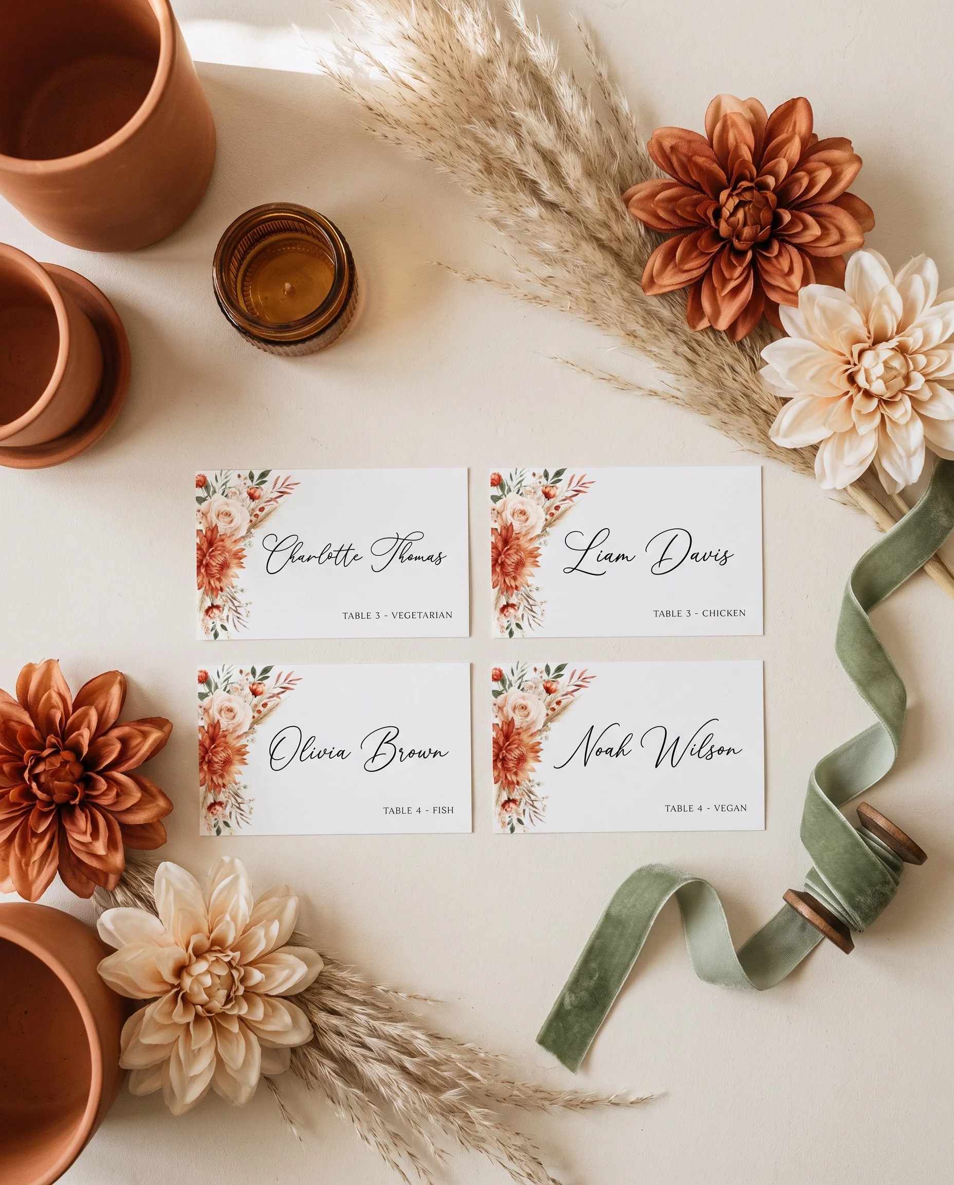 Marigold wedding place cards — several cards shown flat lay under soft natural light at a slight overhead angle, wedding place cards.