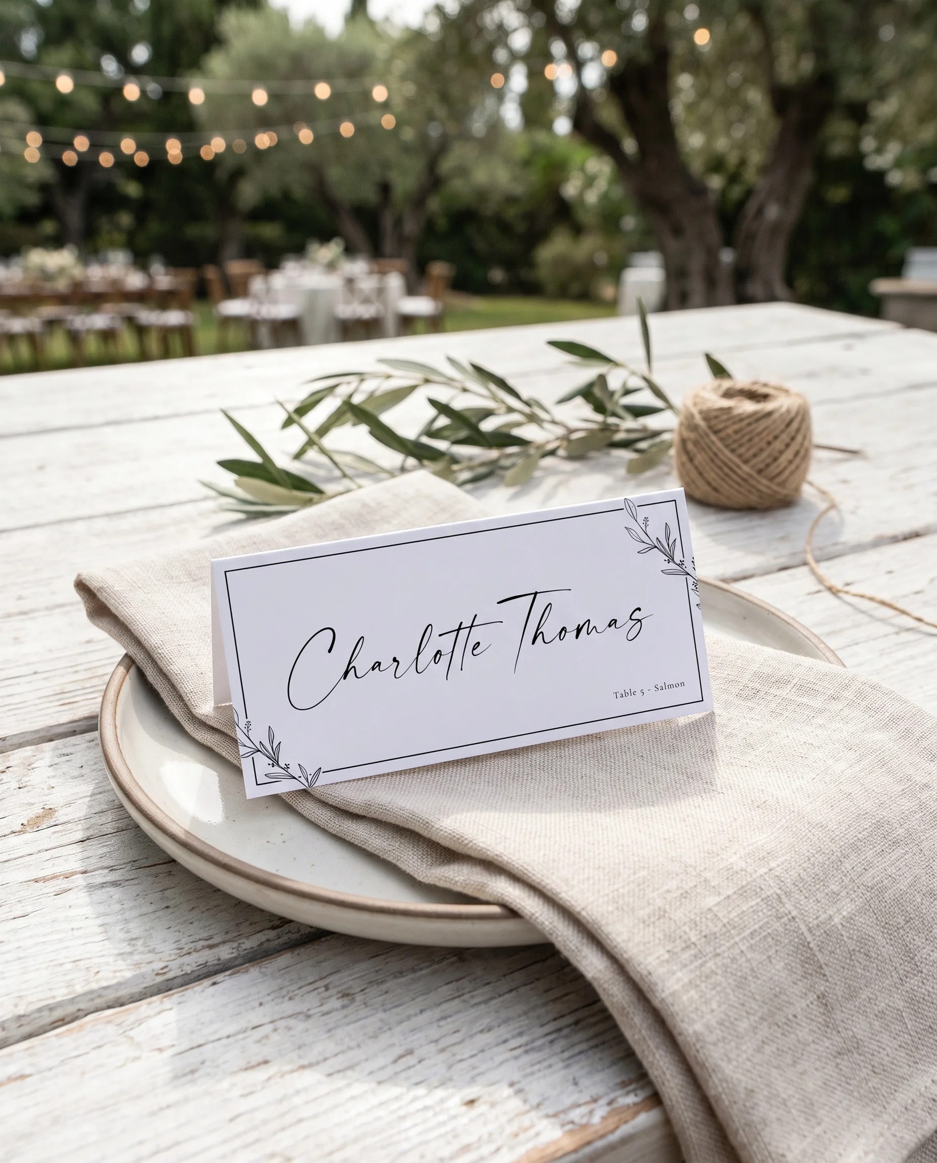 Willow Script wedding place cards — a single card displayed at a set place setting under soft natural light, wedding name cards.