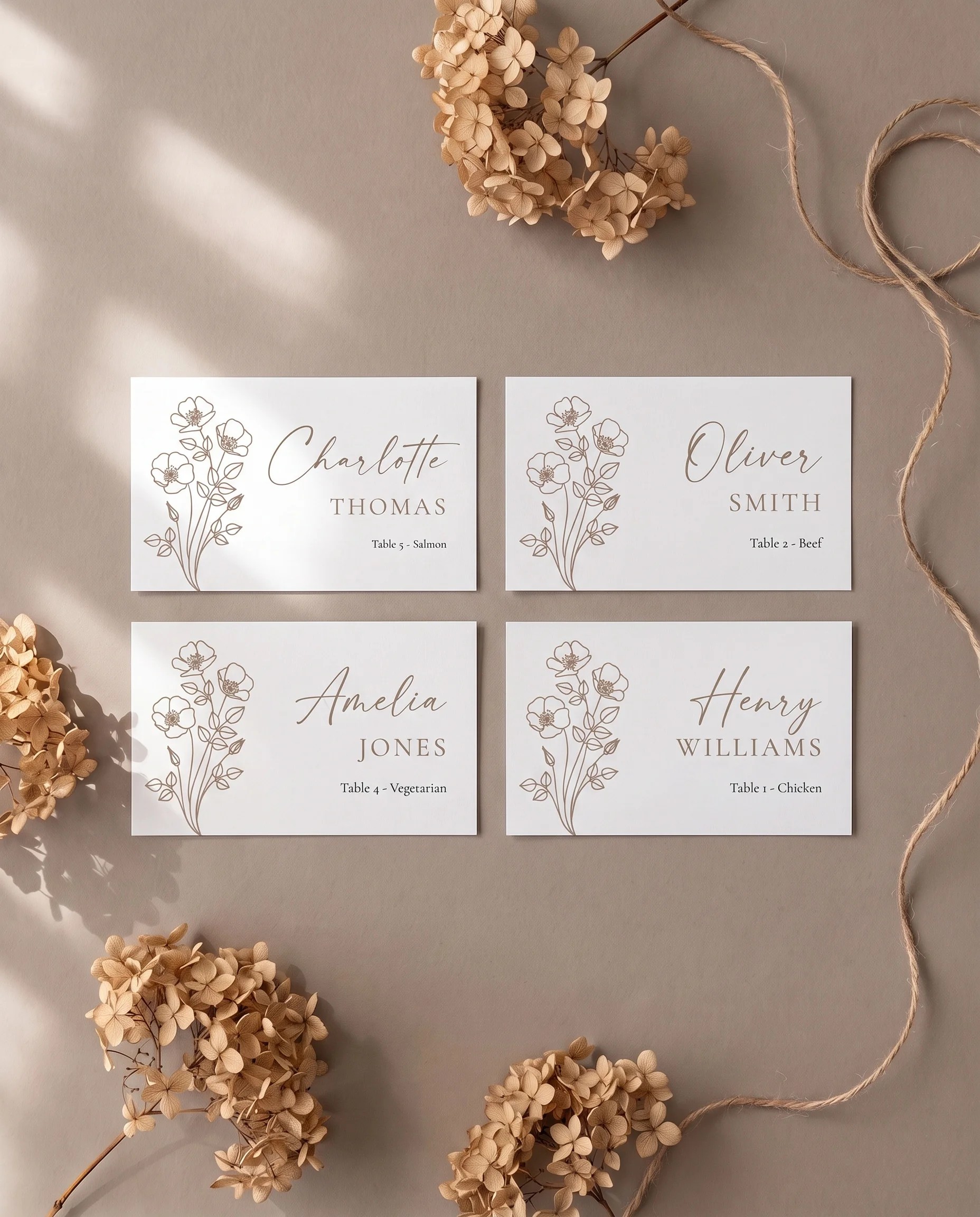 Anemora wedding place cards — several place cards shown flat in an overhead editorial layout on soft natural light, wedding place cards