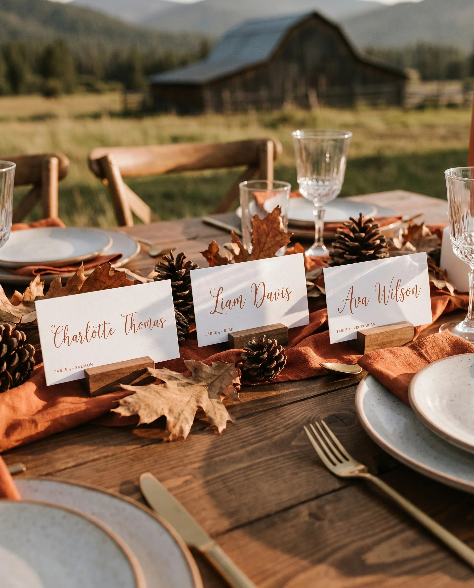 Autumn Vale wedding place cards — several cards arranged on a dressed reception table under soft natural light, place card template.