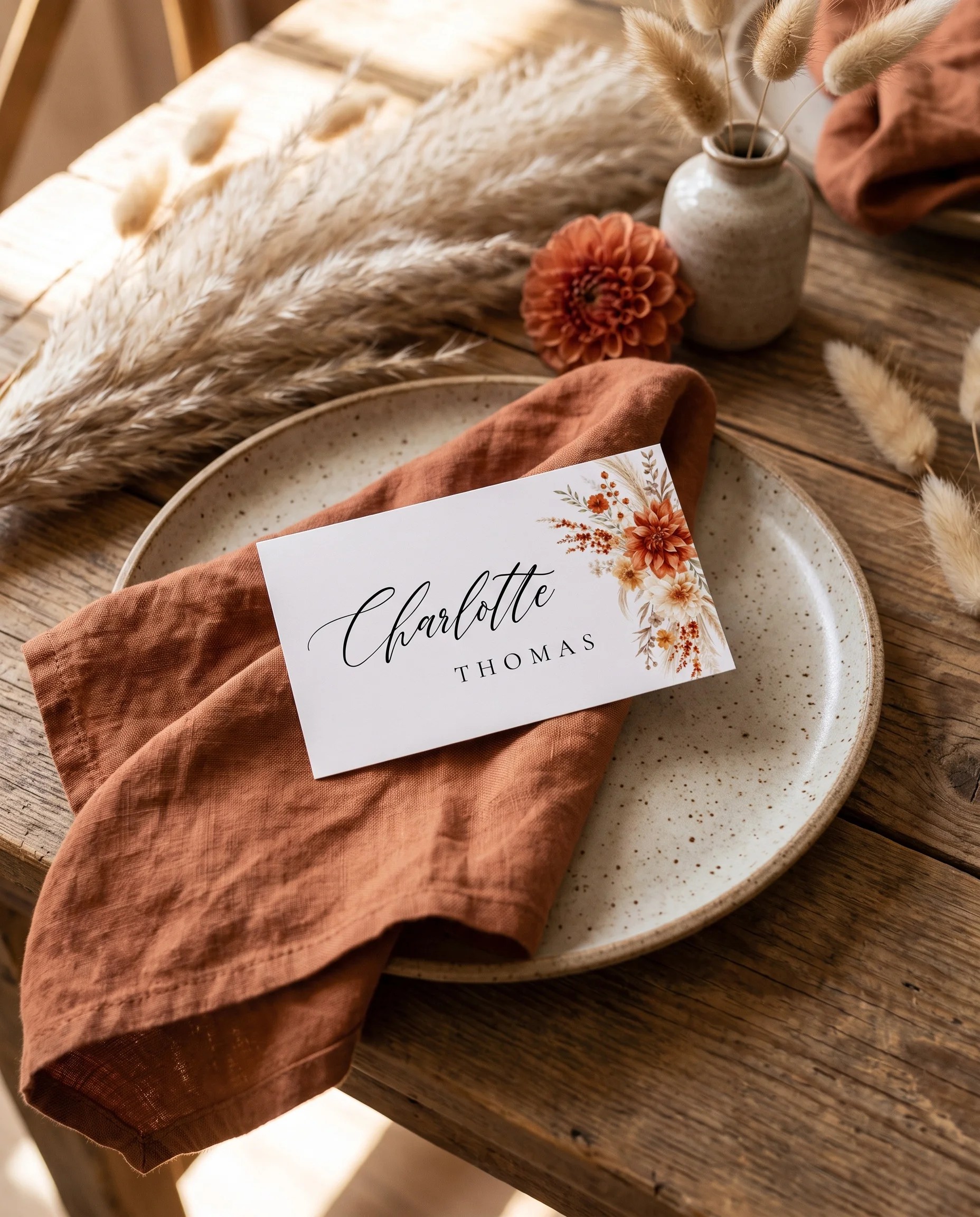 Dahlia Ember wedding place cards — a single card displayed at a set place setting under soft natural light, wedding name cards.