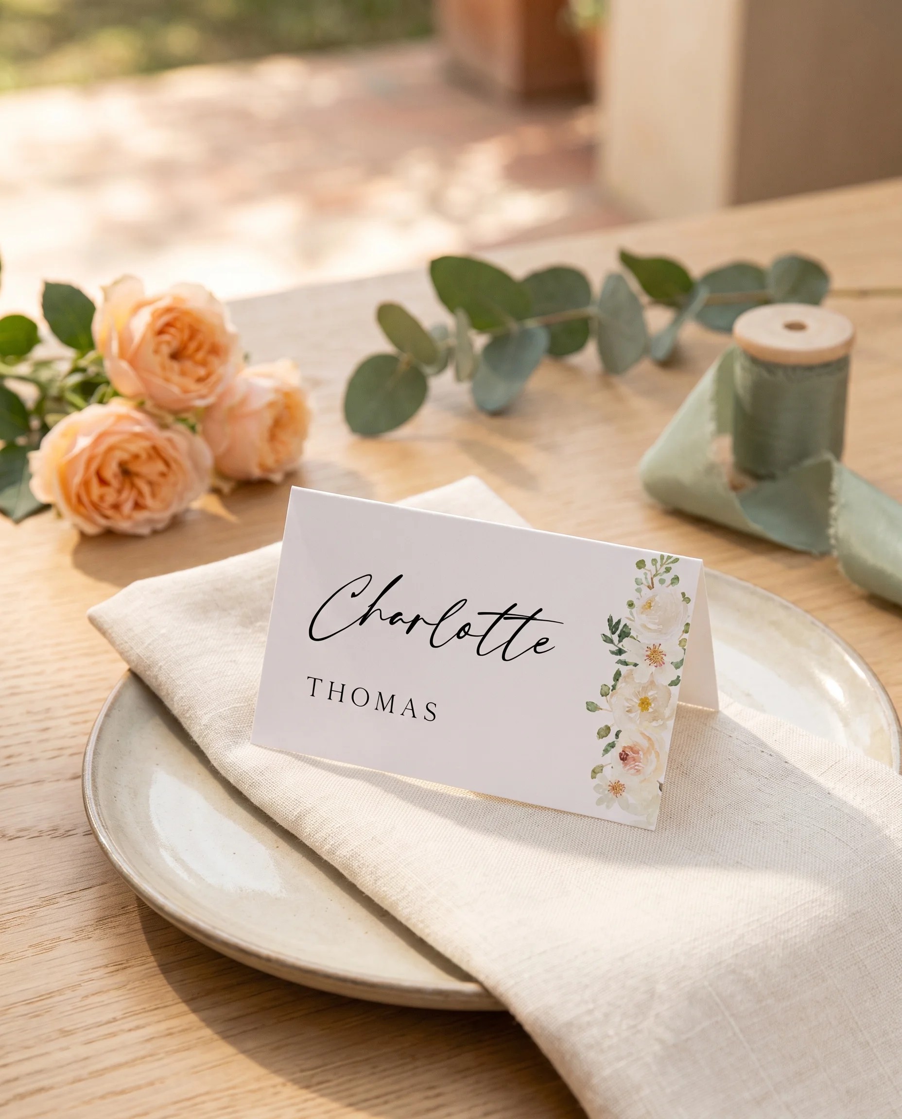 Seraphine wedding place cards — a single place card shown at a set table setting under soft natural light, wedding name cards.