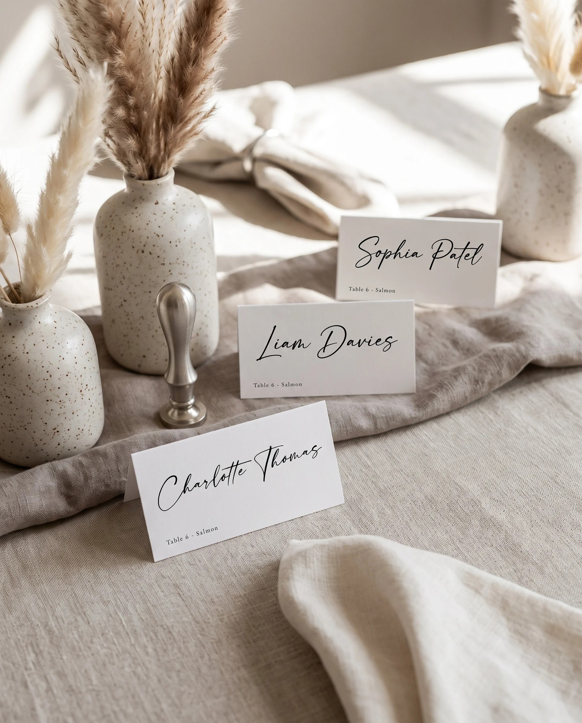 Tonal Reply wedding place cards — arranged on a dressed reception table under soft natural light, place card template.