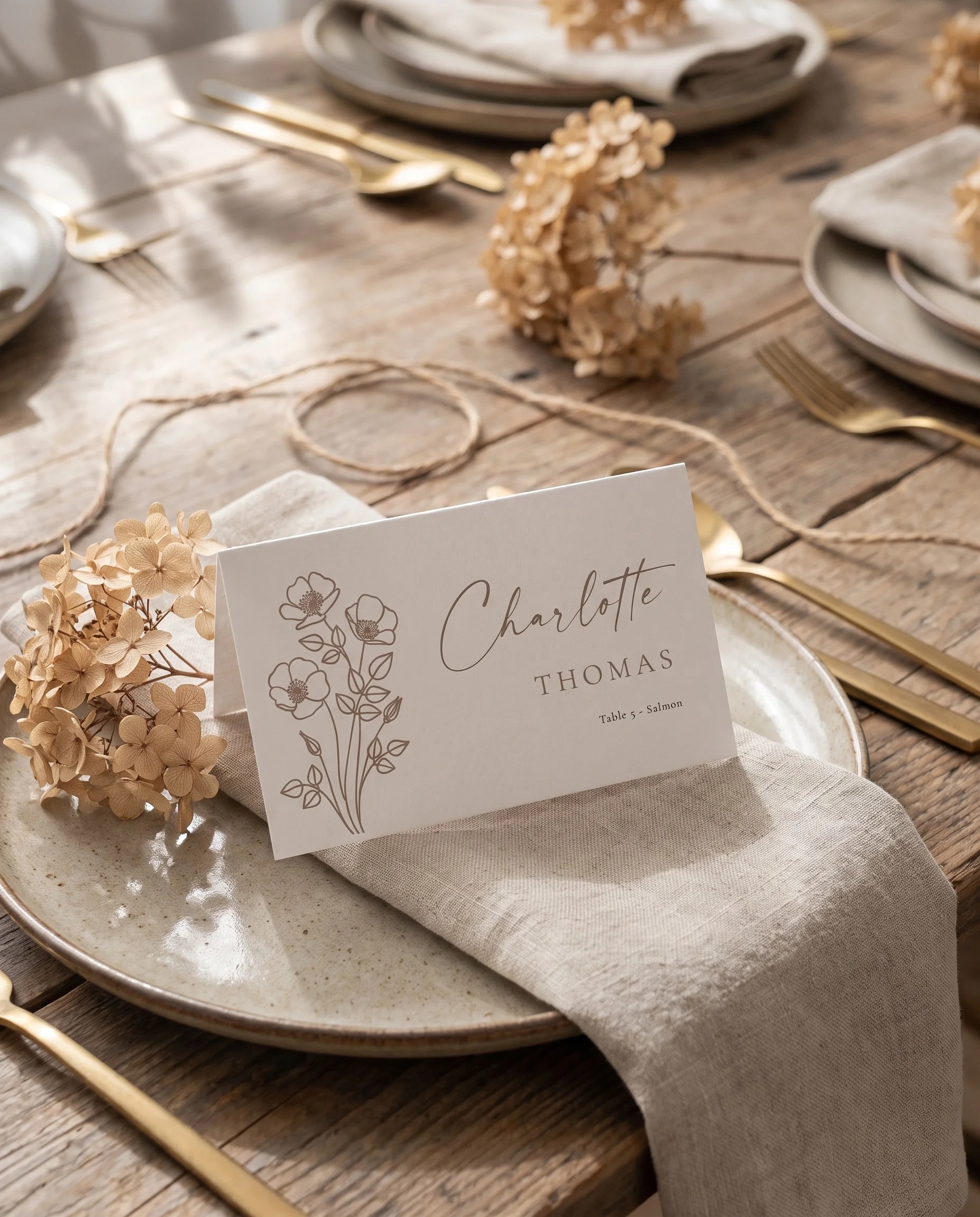 Anemora wedding place cards — a single place card displayed at a set place setting under soft natural light, wedding name cards.