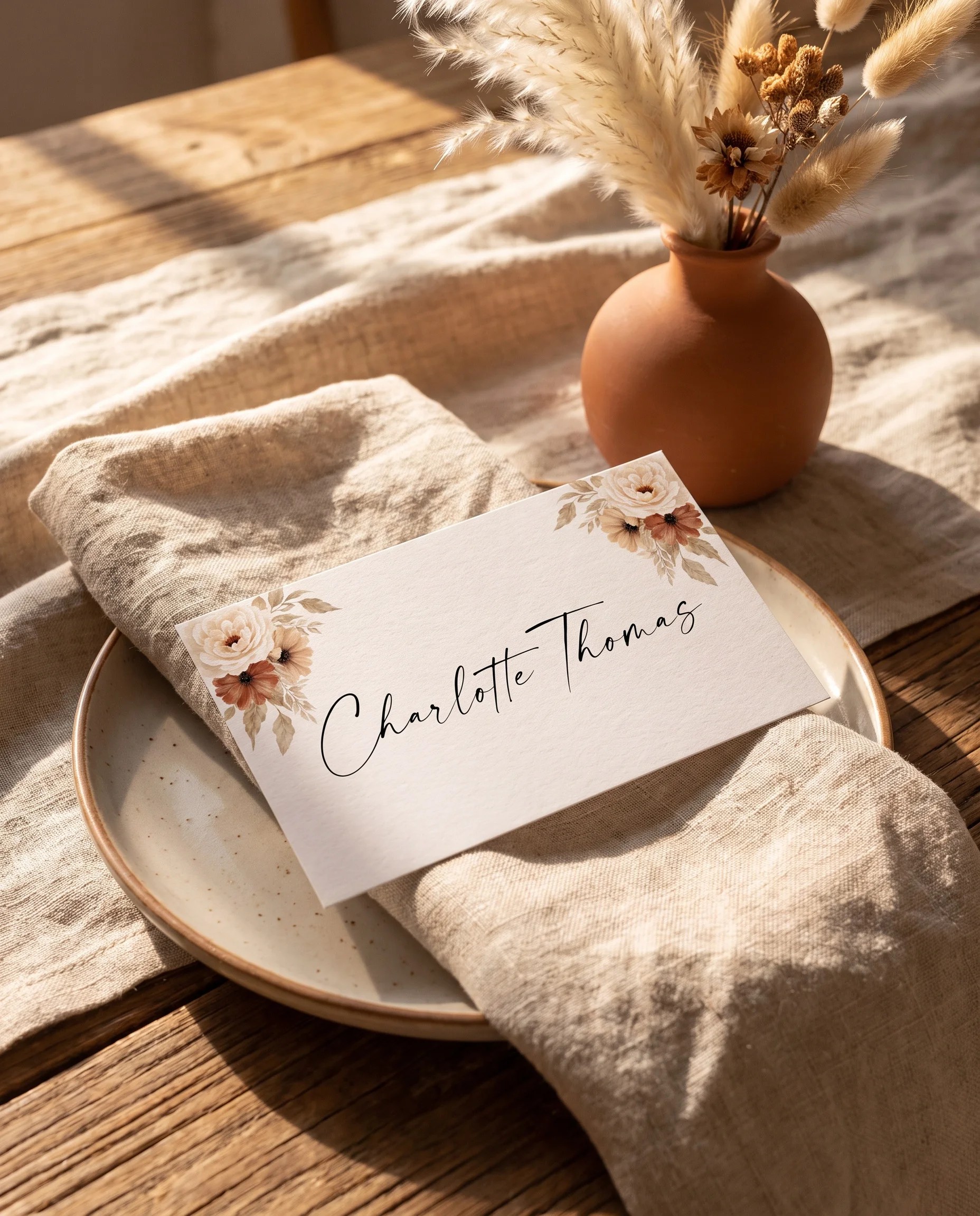 Pampas Bloom wedding place cards — a single card displayed at a set place setting under soft natural light, wedding name cards.