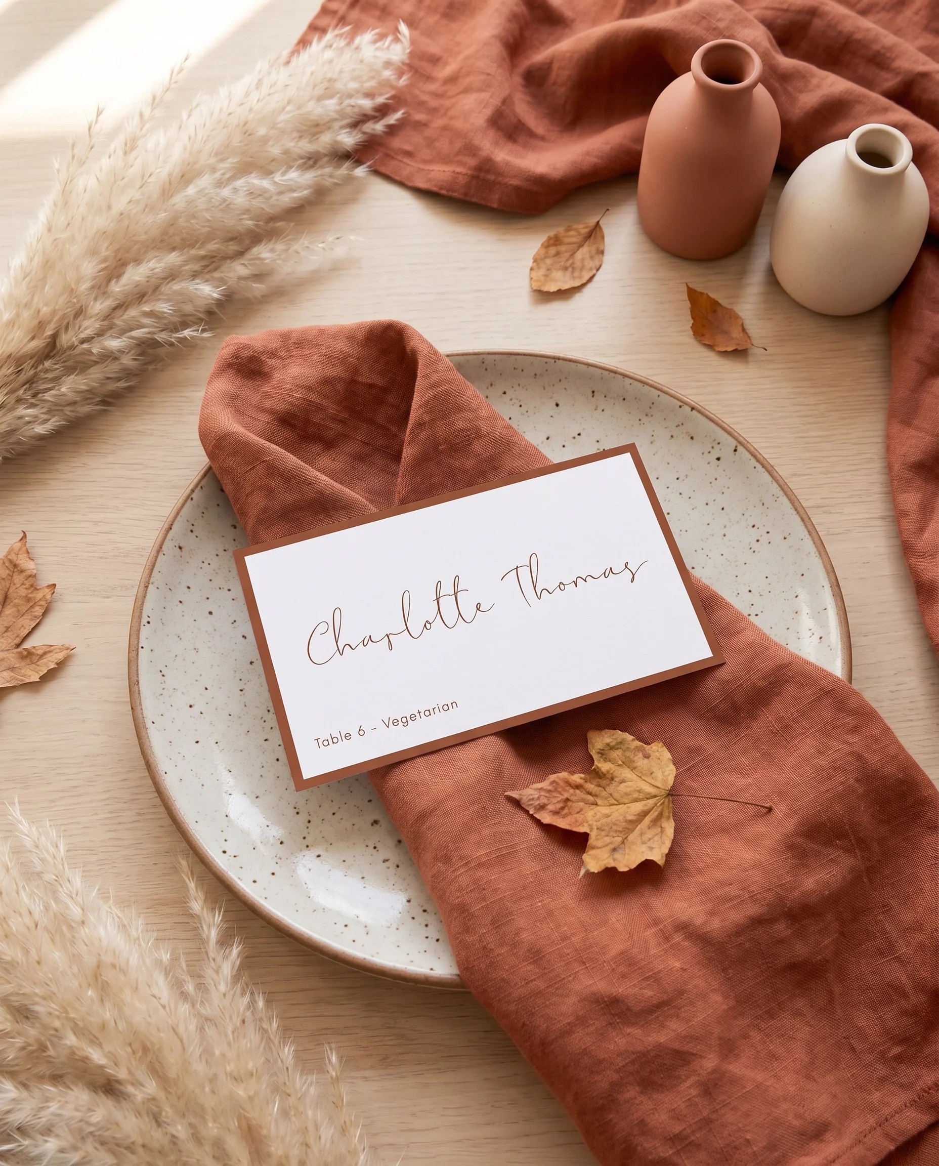 Stevens wedding place cards — a single place card resting at a table setting, softly lit from above, wedding name cards.