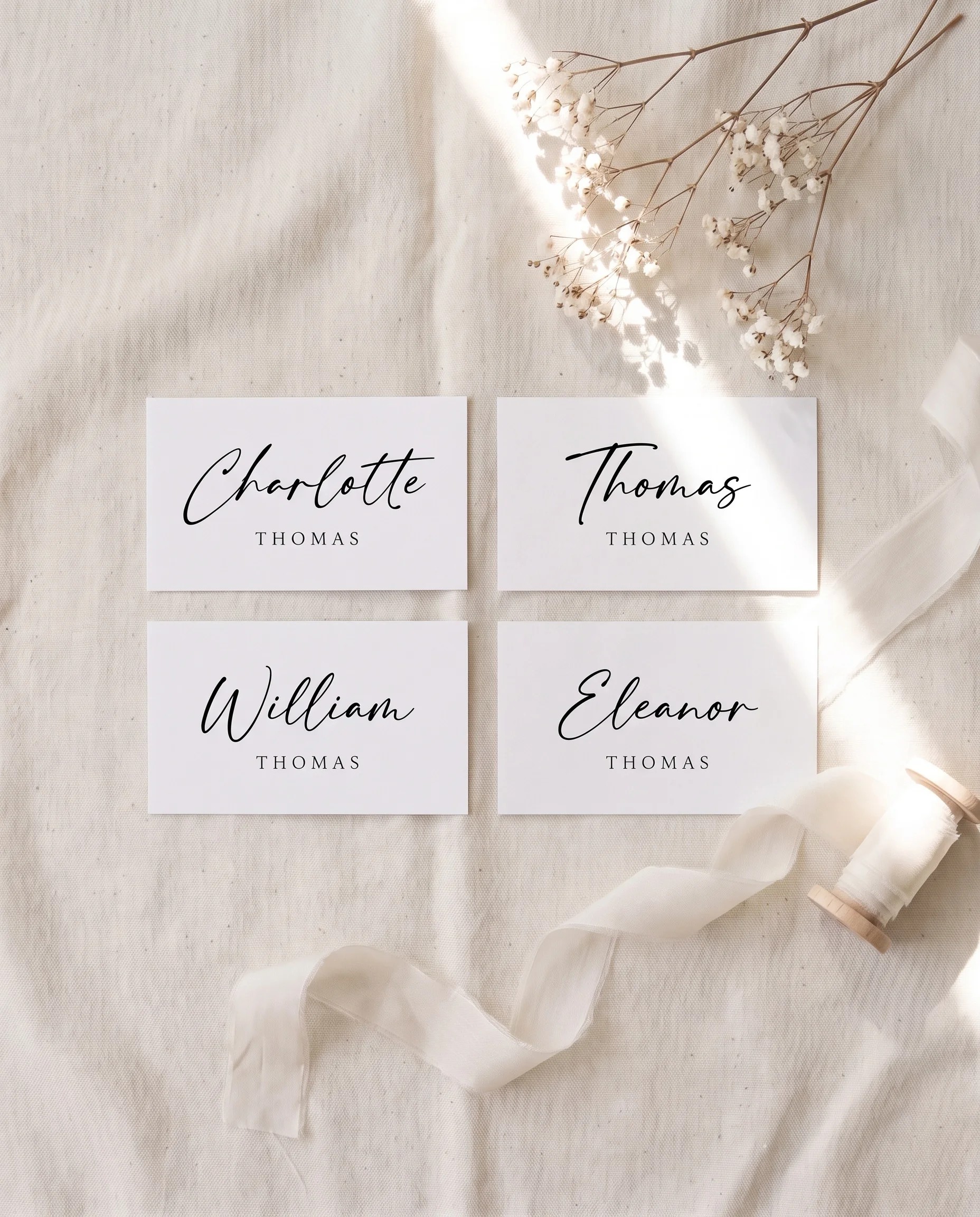 Cathedral wedding place cards — several place cards shown flat under soft natural light, wedding place cards.