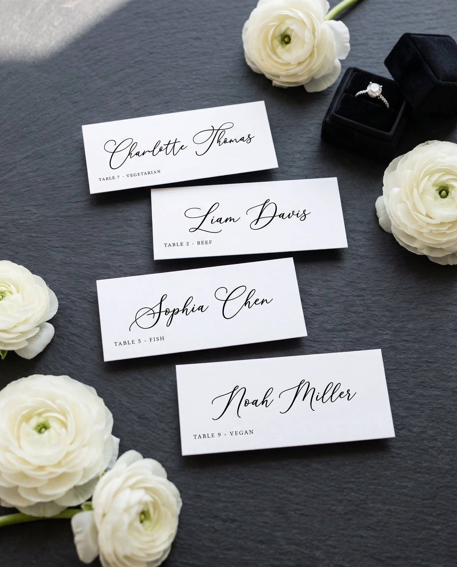 Monochrome Veil wedding place cards — several place cards shown flat under soft natural light, wedding place cards