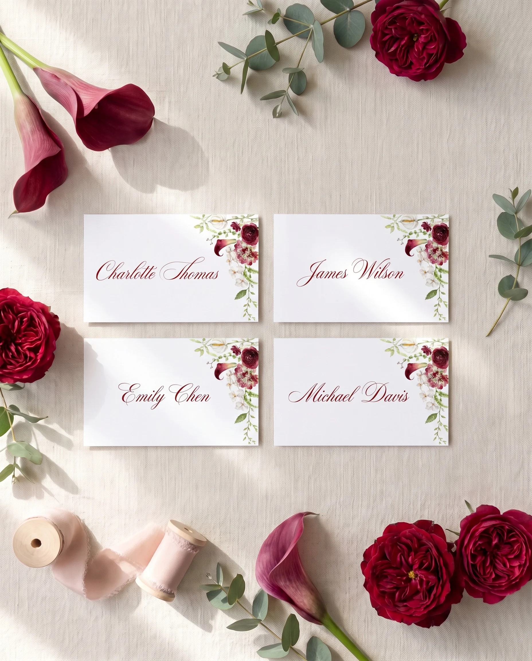 Burgundy Calla wedding place cards — several place cards shown flat under soft natural light, wedding place cards.