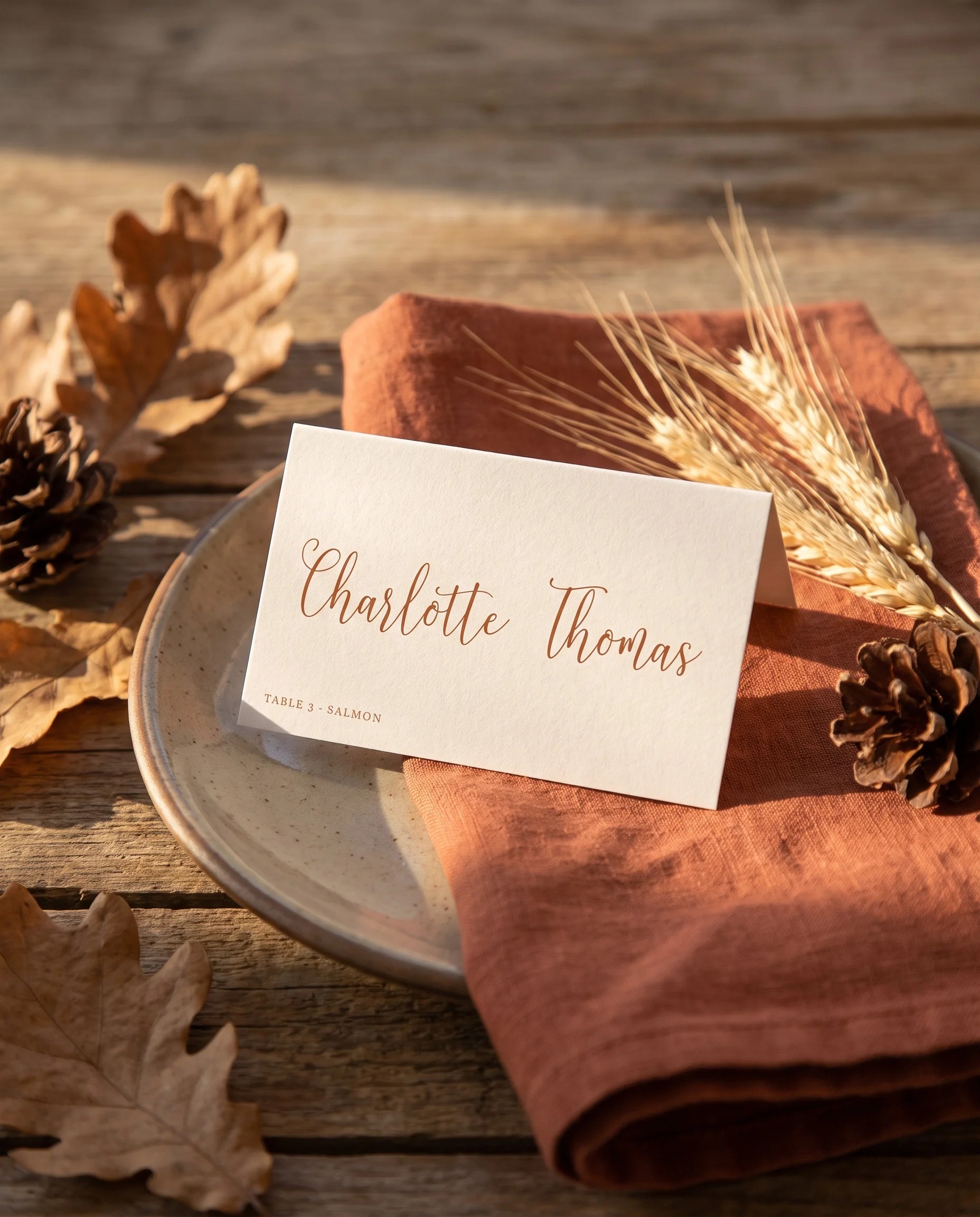Autumn Vale wedding place cards — single card displayed at a set place setting under soft natural light, wedding name cards.