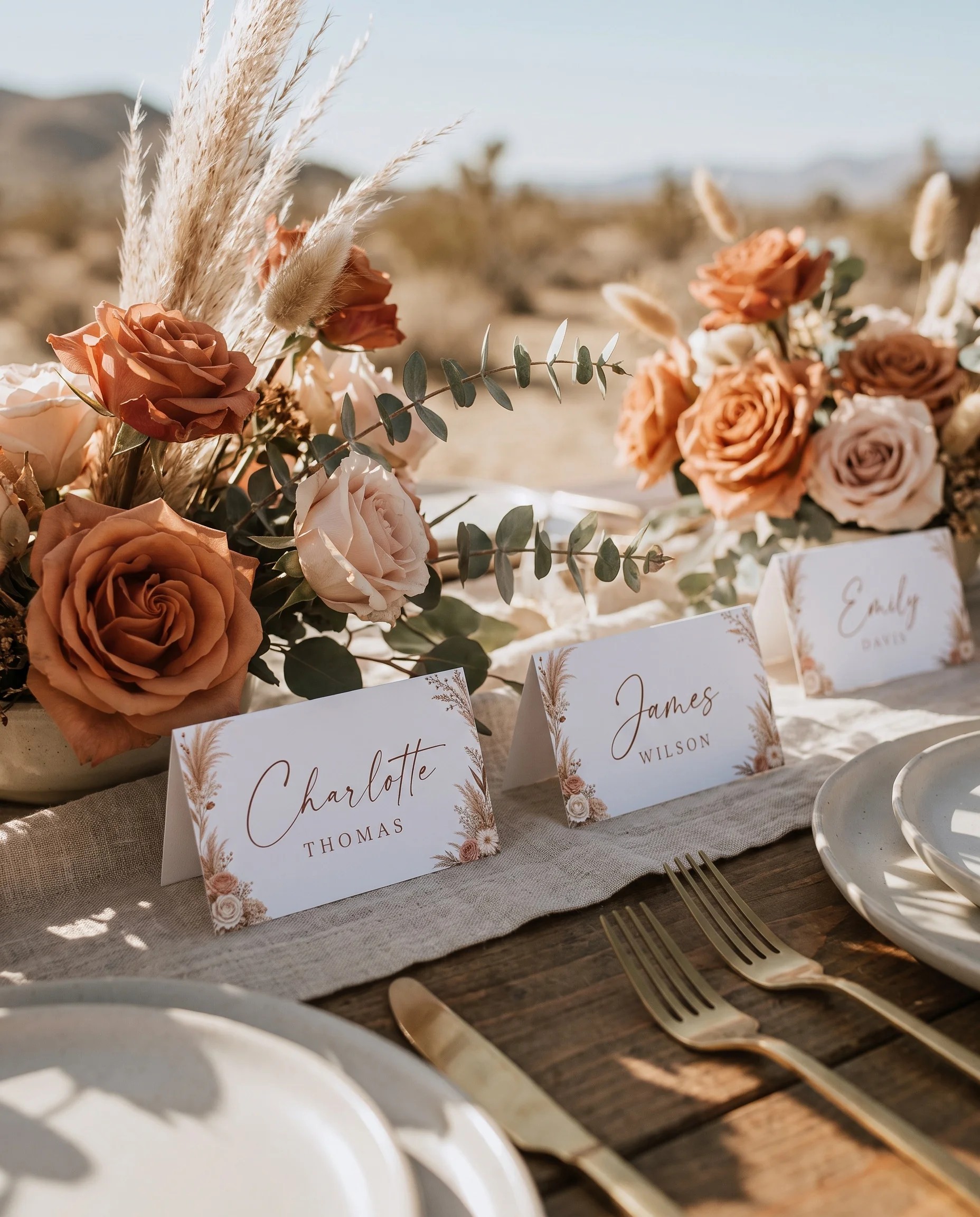 Pampas Hush wedding place cards — cards arranged on a dressed reception table under soft natural light, place card template.