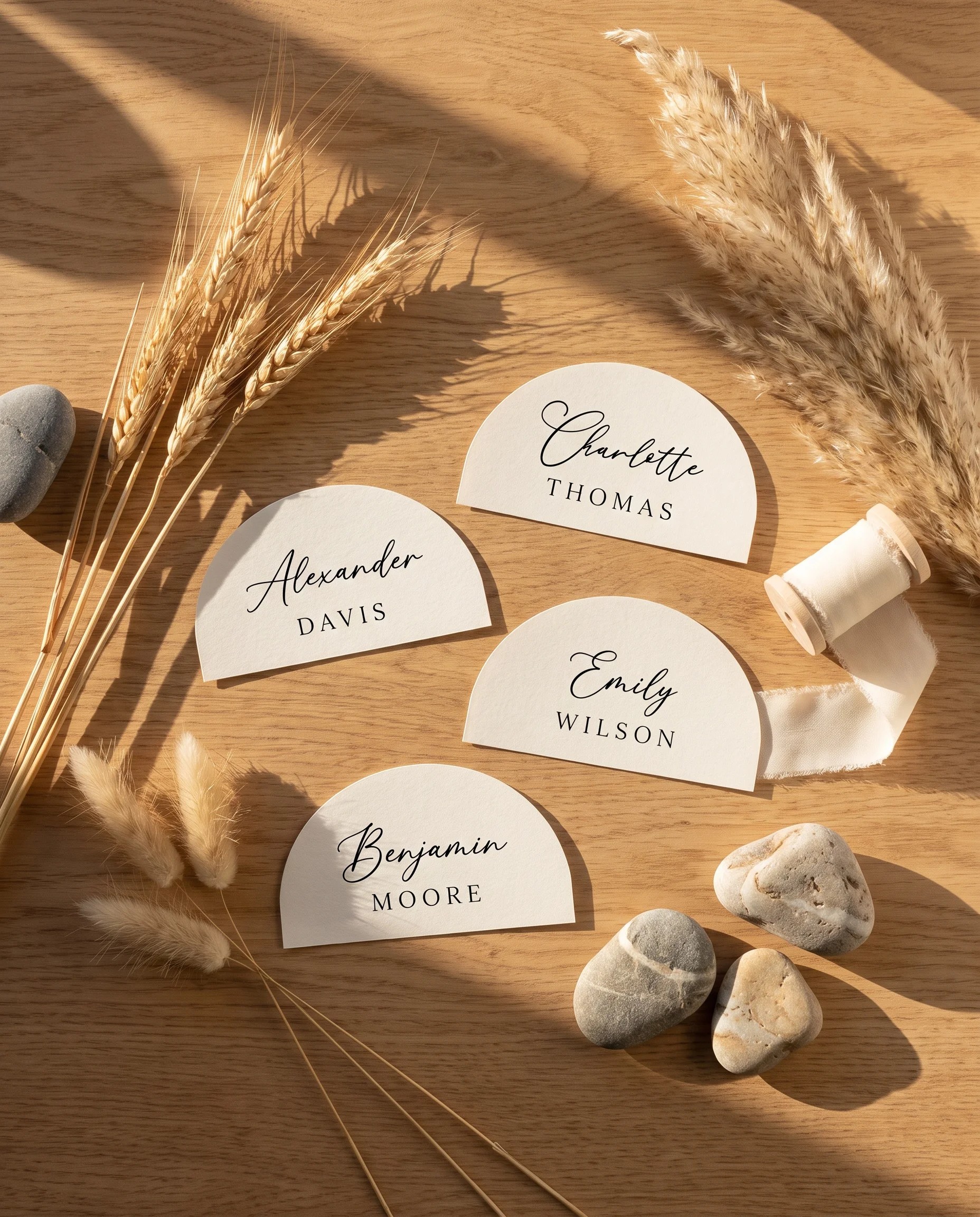 Halo Arch wedding place cards — flat lay of several place cards under soft natural light, wedding place cards.