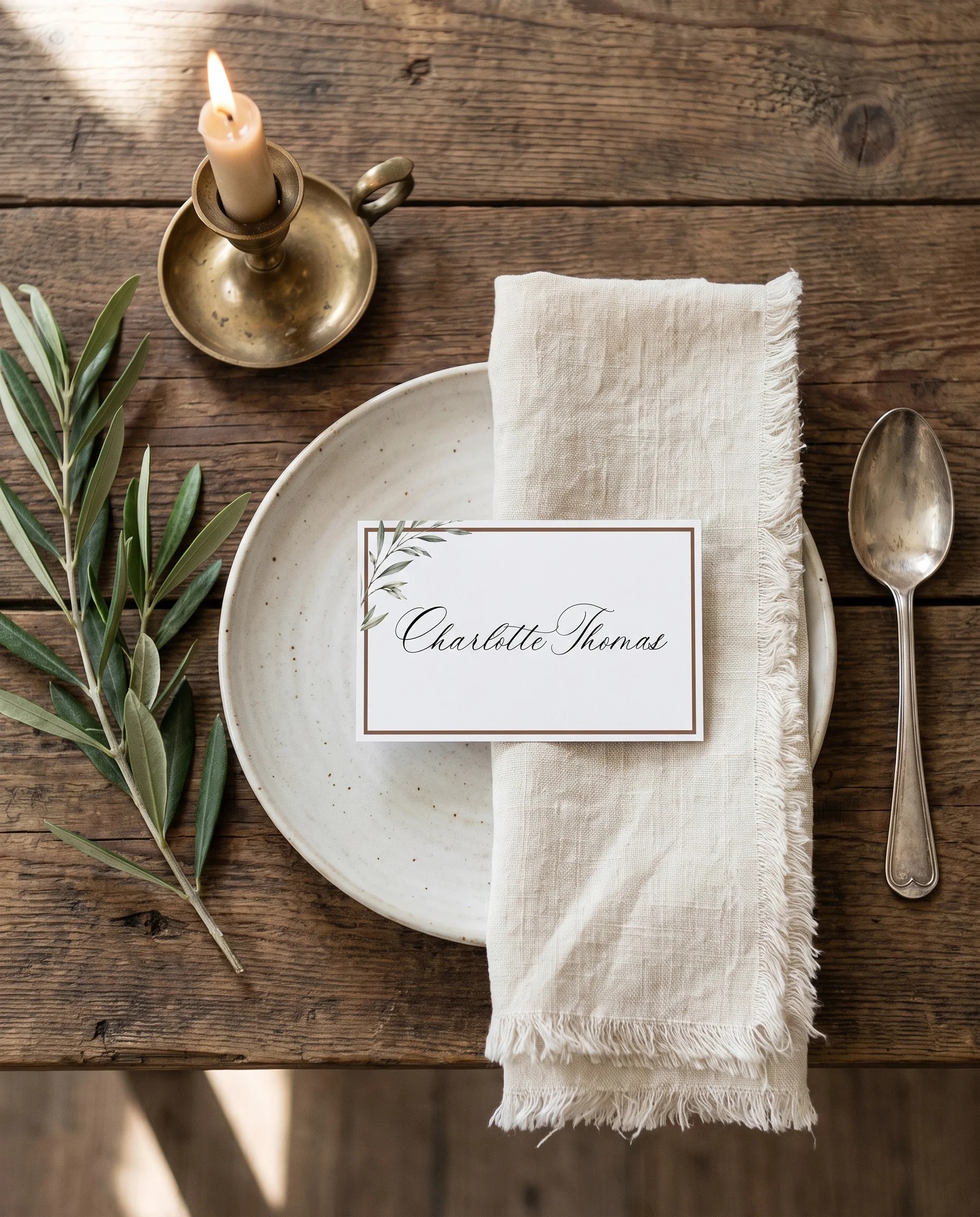 Olive Arc wedding place cards — a single card displayed at a set place setting under soft natural light, wedding name cards.