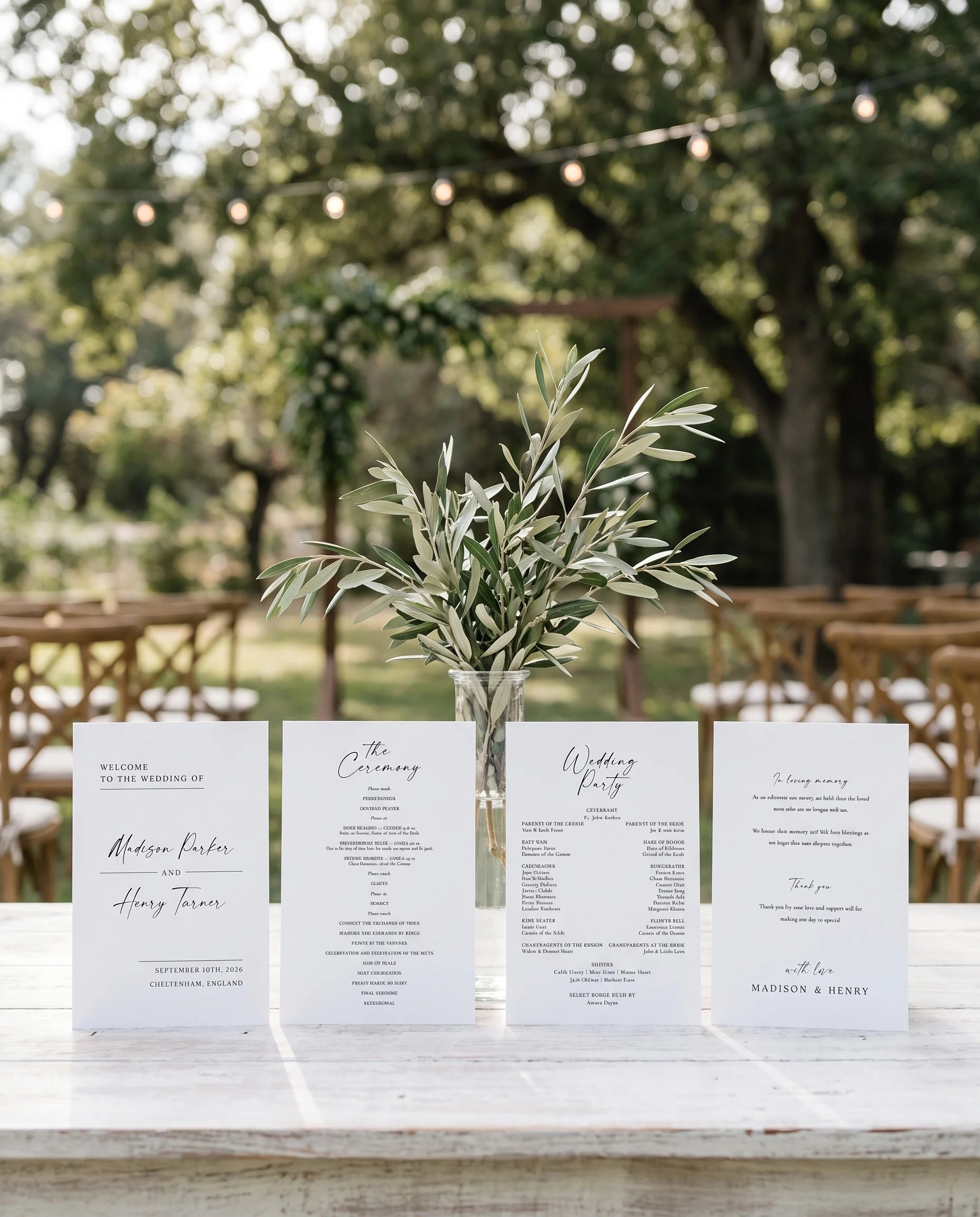 Willow wedding program — four flat program cards standing upright at a ceremony under soft natural light, wedding program template.