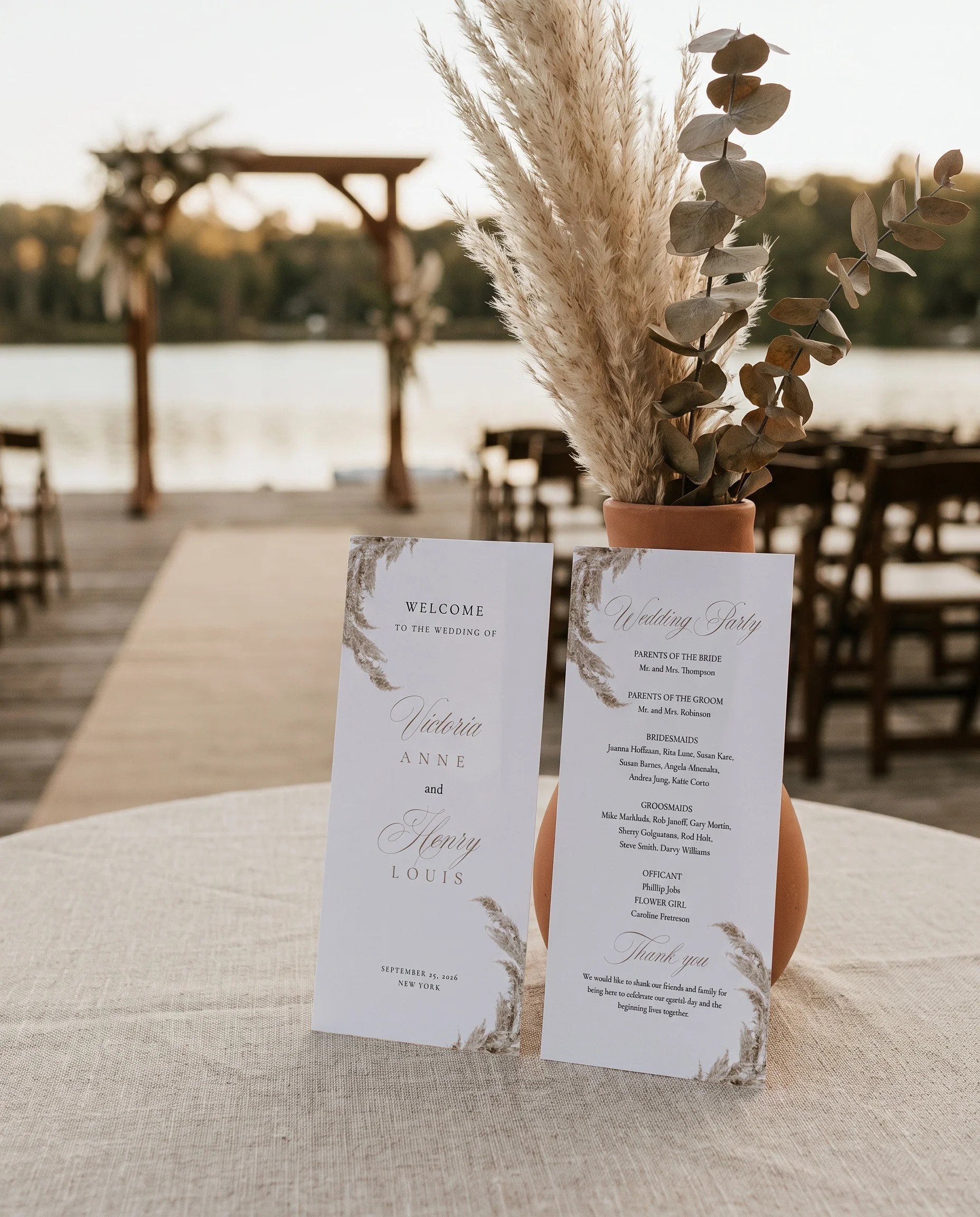 Pampas wedding program — two flat cards standing upright at a ceremony setting in soft natural light, wedding program template.