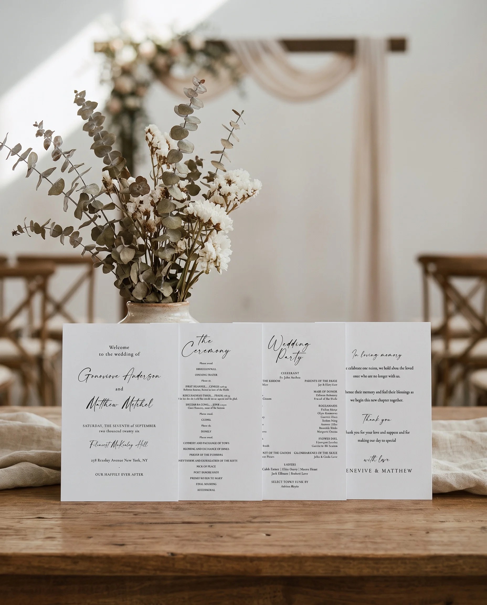 Arcadia wedding program — four flat cards standing upright at a ceremony under soft natural light, wedding program template