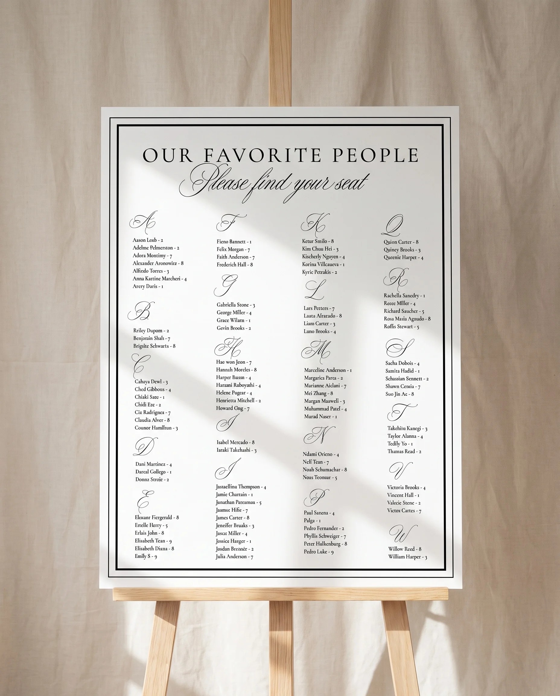 Heirloom wedding seating chart — single page displayed on an easel under soft natural light, premium editorial wedding seating chart