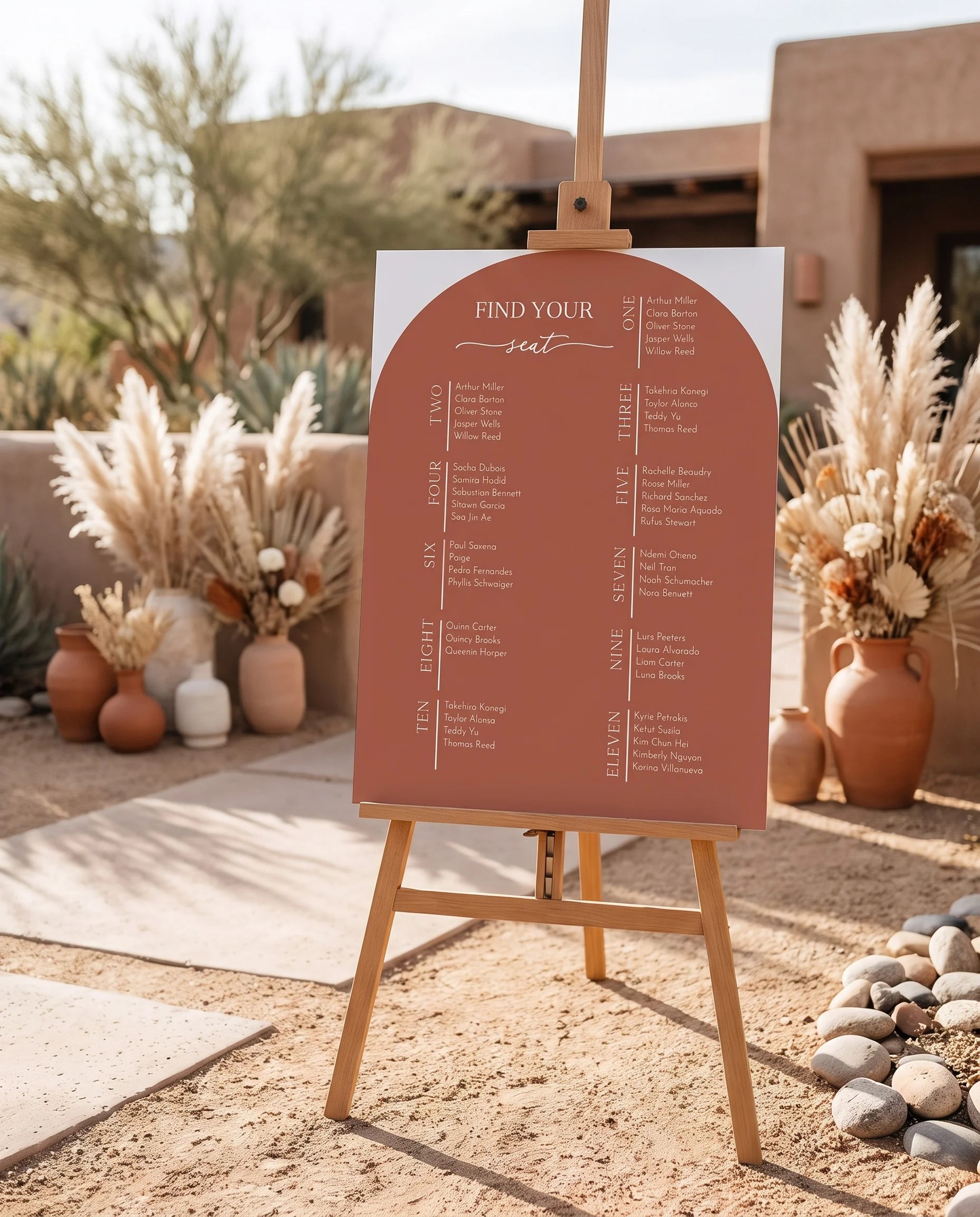 Desert Bloom wedding seating chart — single page displayed at a reception entrance under soft natural light, seating chart template.