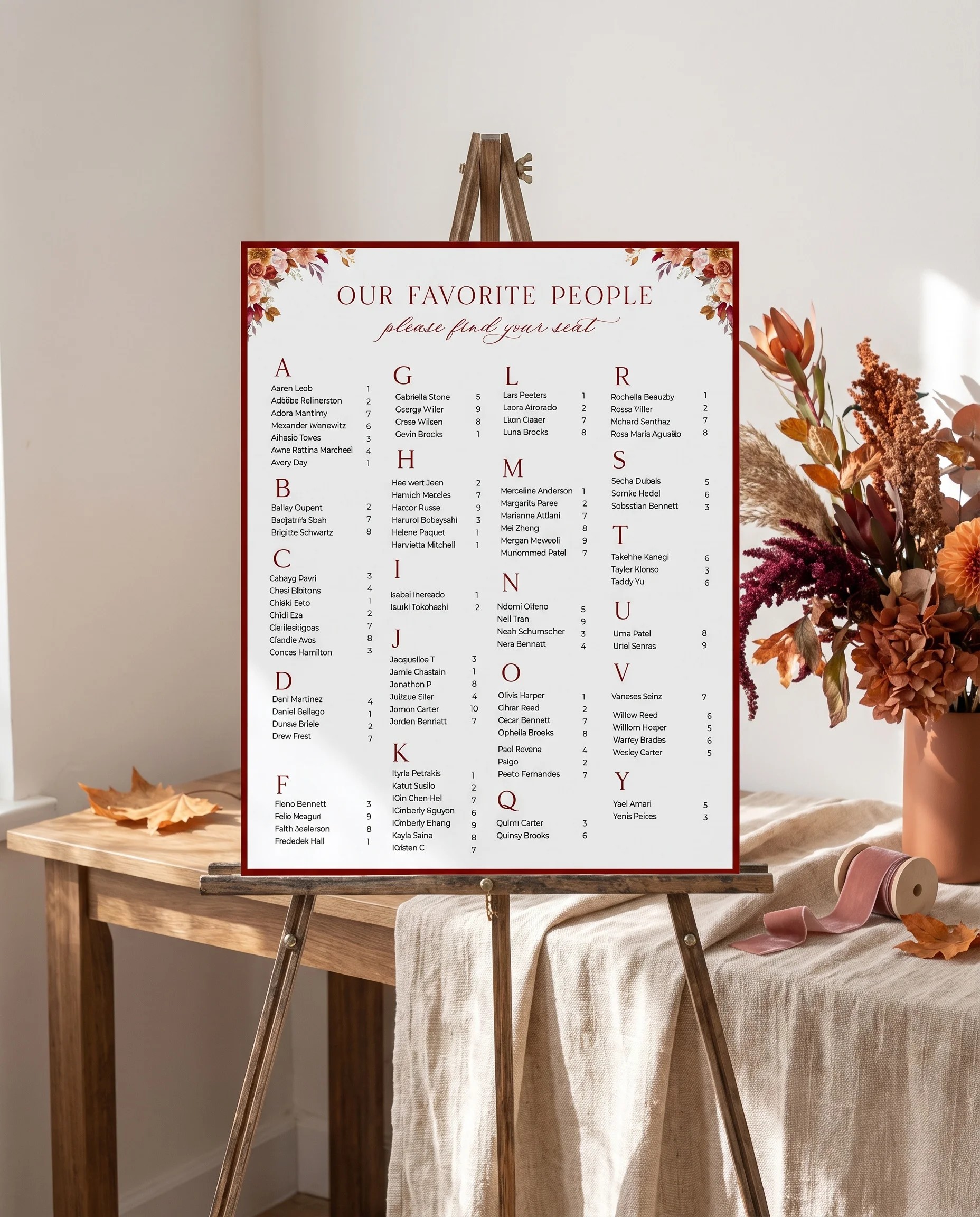 Autumn Blush wedding seating chart — single page shown beside furniture for scale under soft natural light, wedding seating chart template