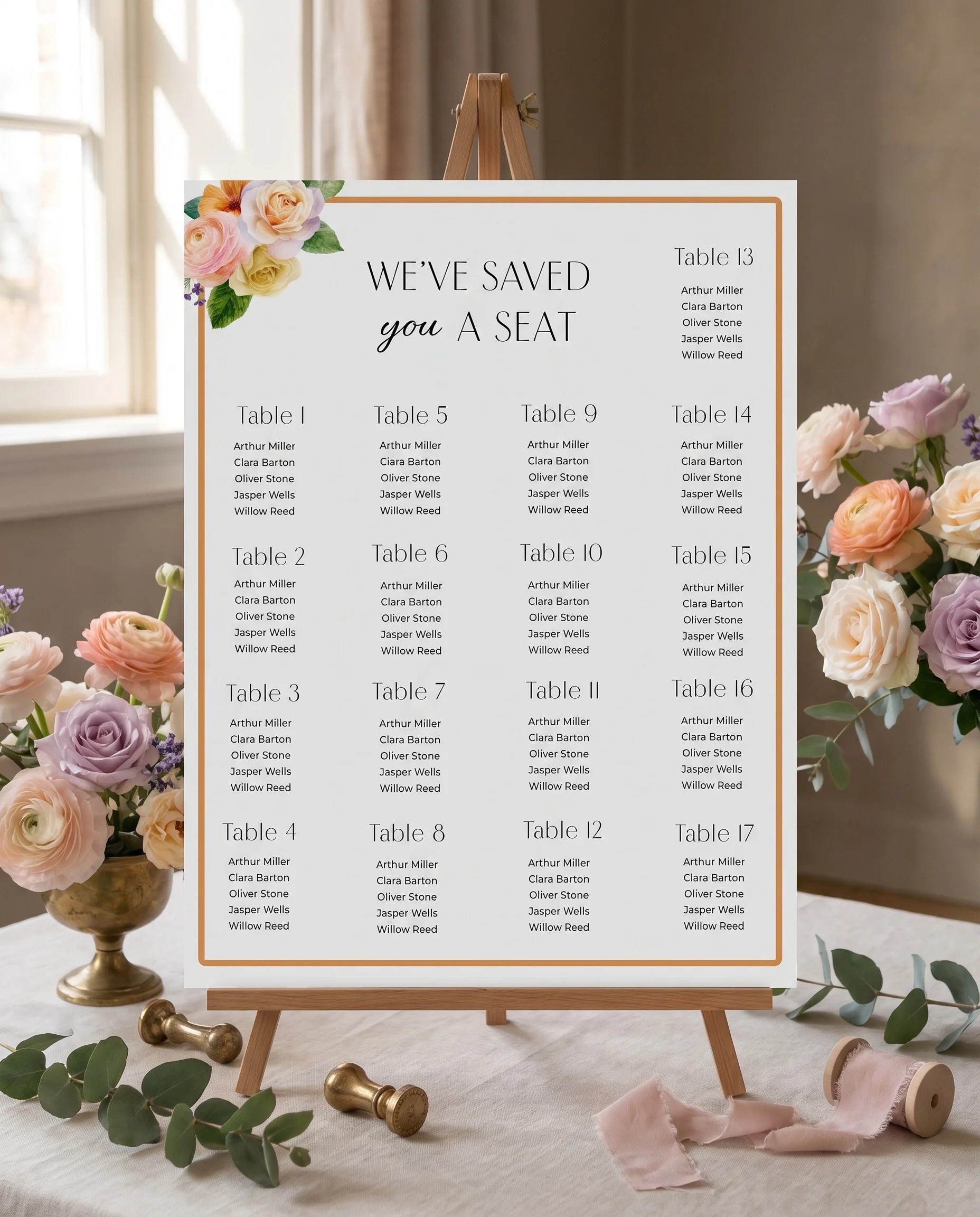 Petal Glade wedding seating chart — displayed on an easel under soft natural light at a slight overhead angle, wedding seating chart.