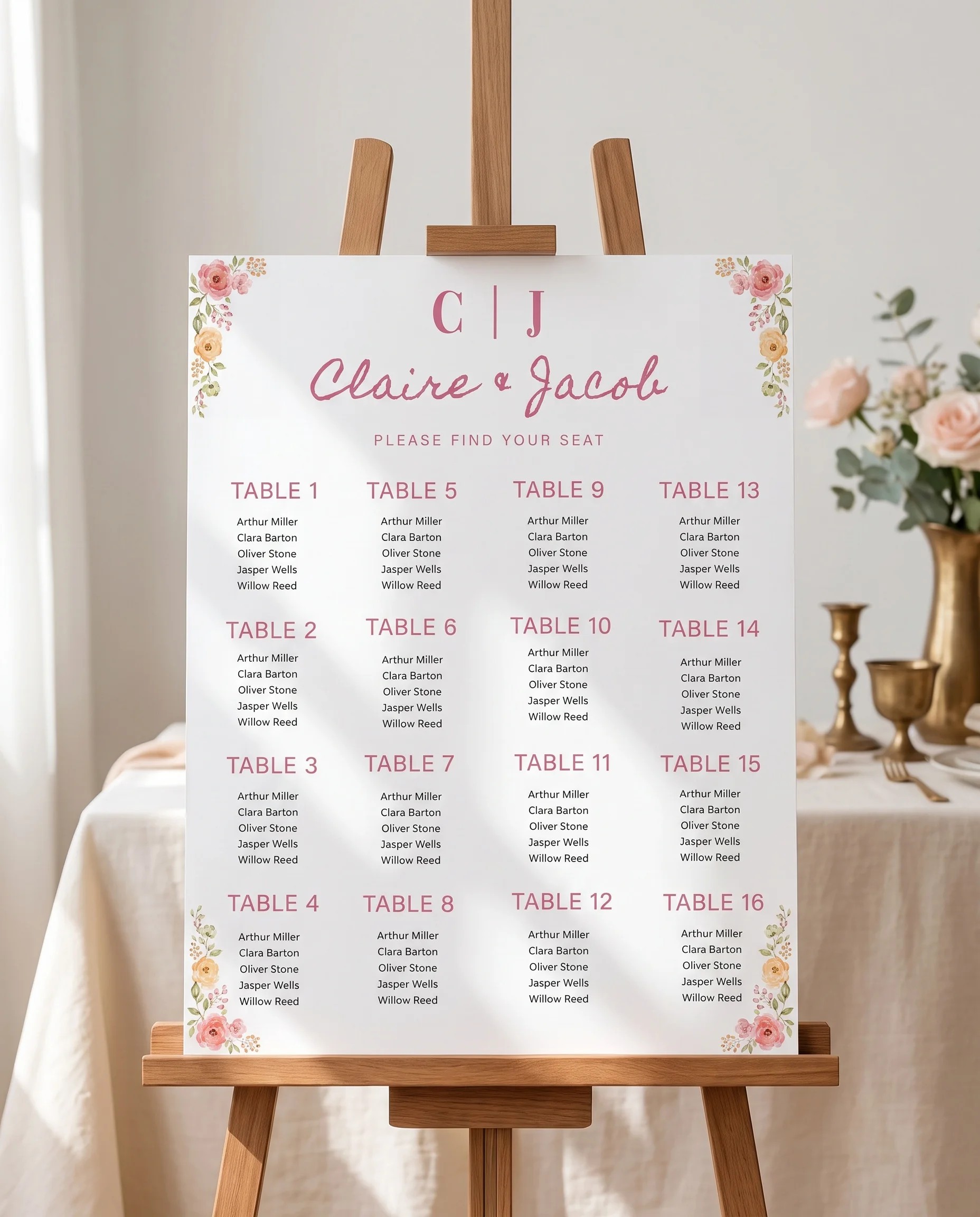 Blush Garland wedding seating chart — displayed on an easel under soft natural light with a slight overhead angle, wedding seating chart.