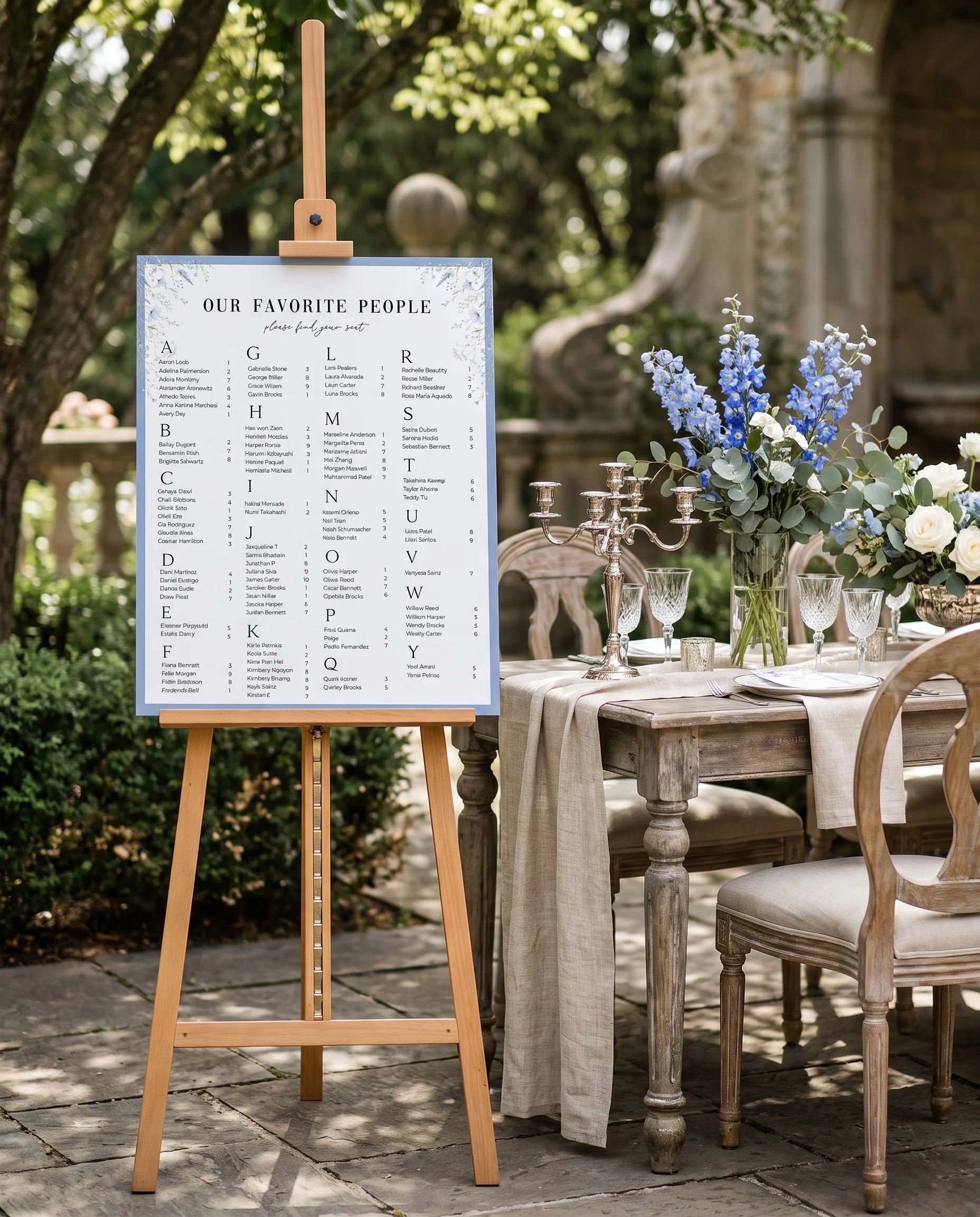 Azure Sprig wedding seating chart — single page shown beside furniture for scale under soft natural light, wedding seating chart template.