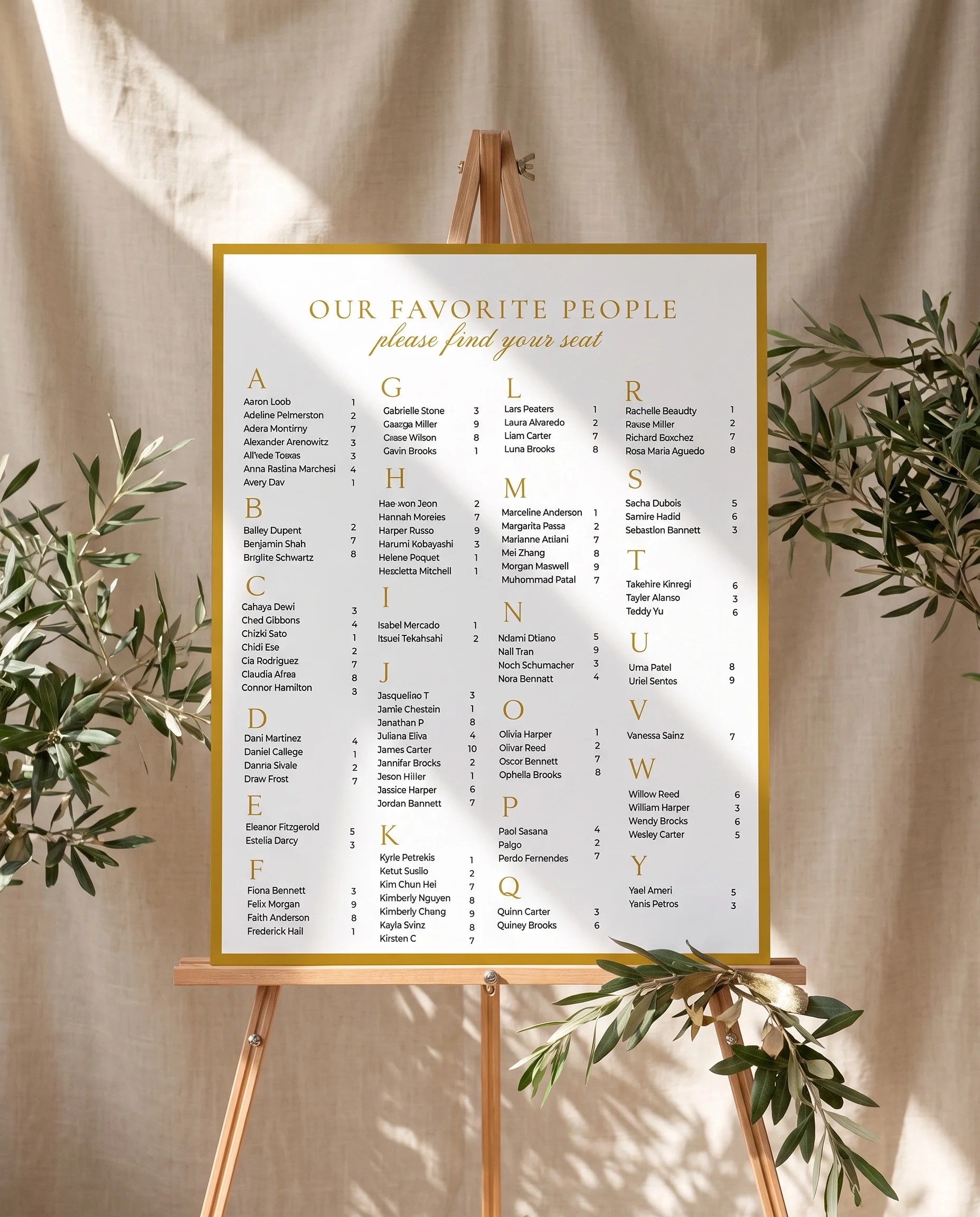 Gilded Arrow wedding seating chart — displayed on an easel under soft natural light with a slight overhead angle, wedding seating chart.