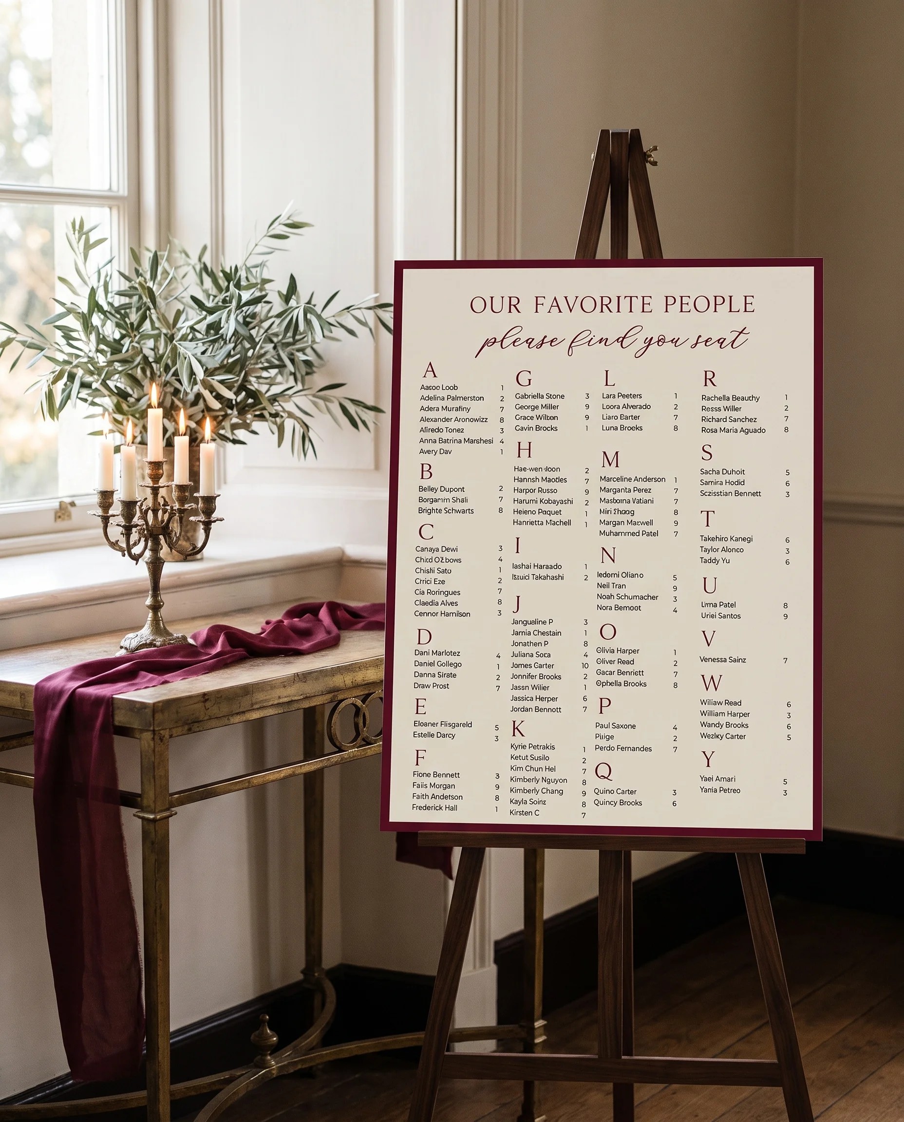 Claret Vine wedding seating chart — single page shown beside furniture for scale under soft natural light, wedding seating chart template.
