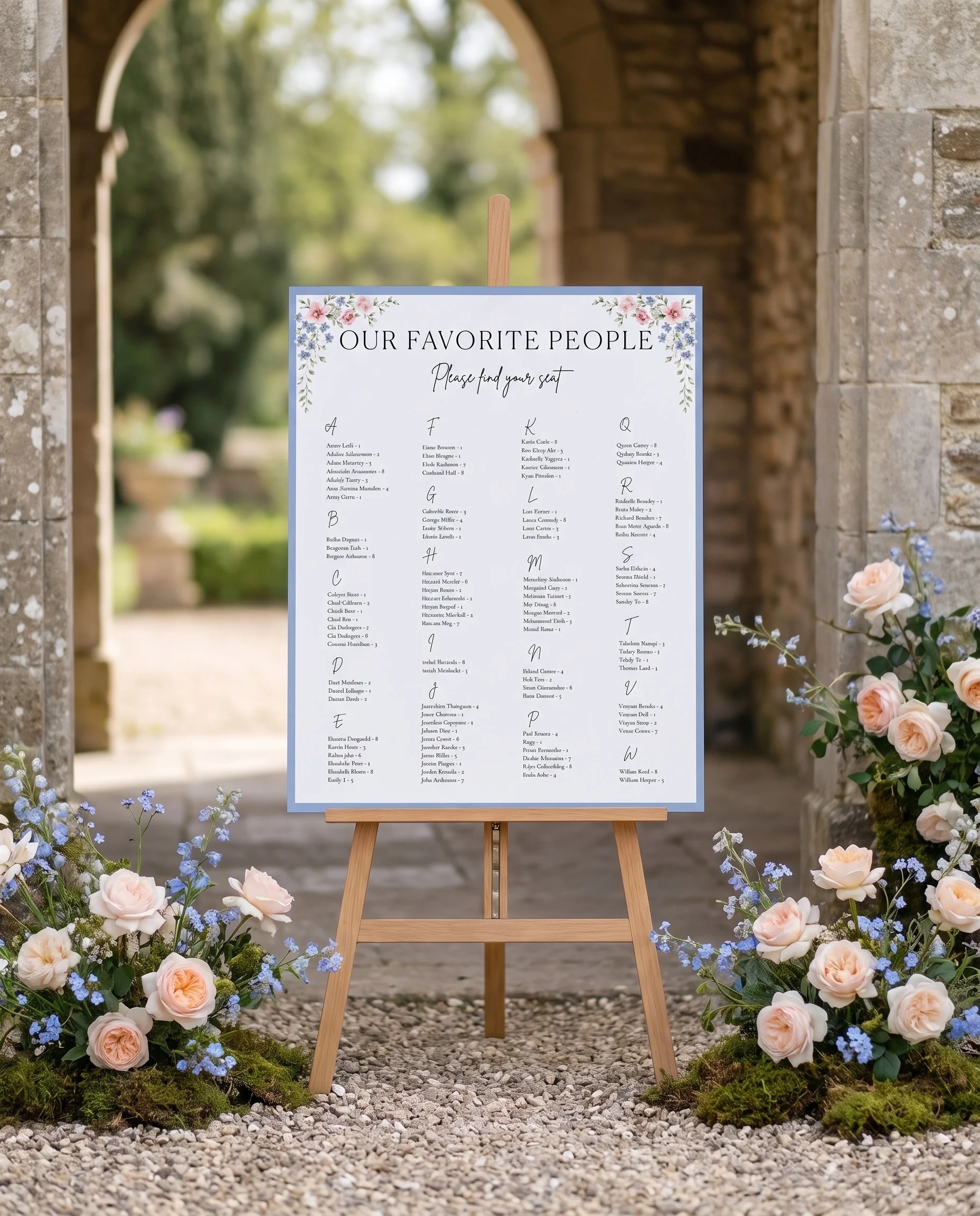Meadow Spire wedding seating chart — displayed at a reception entrance under soft natural light with a slight overhead angle, seating chart template