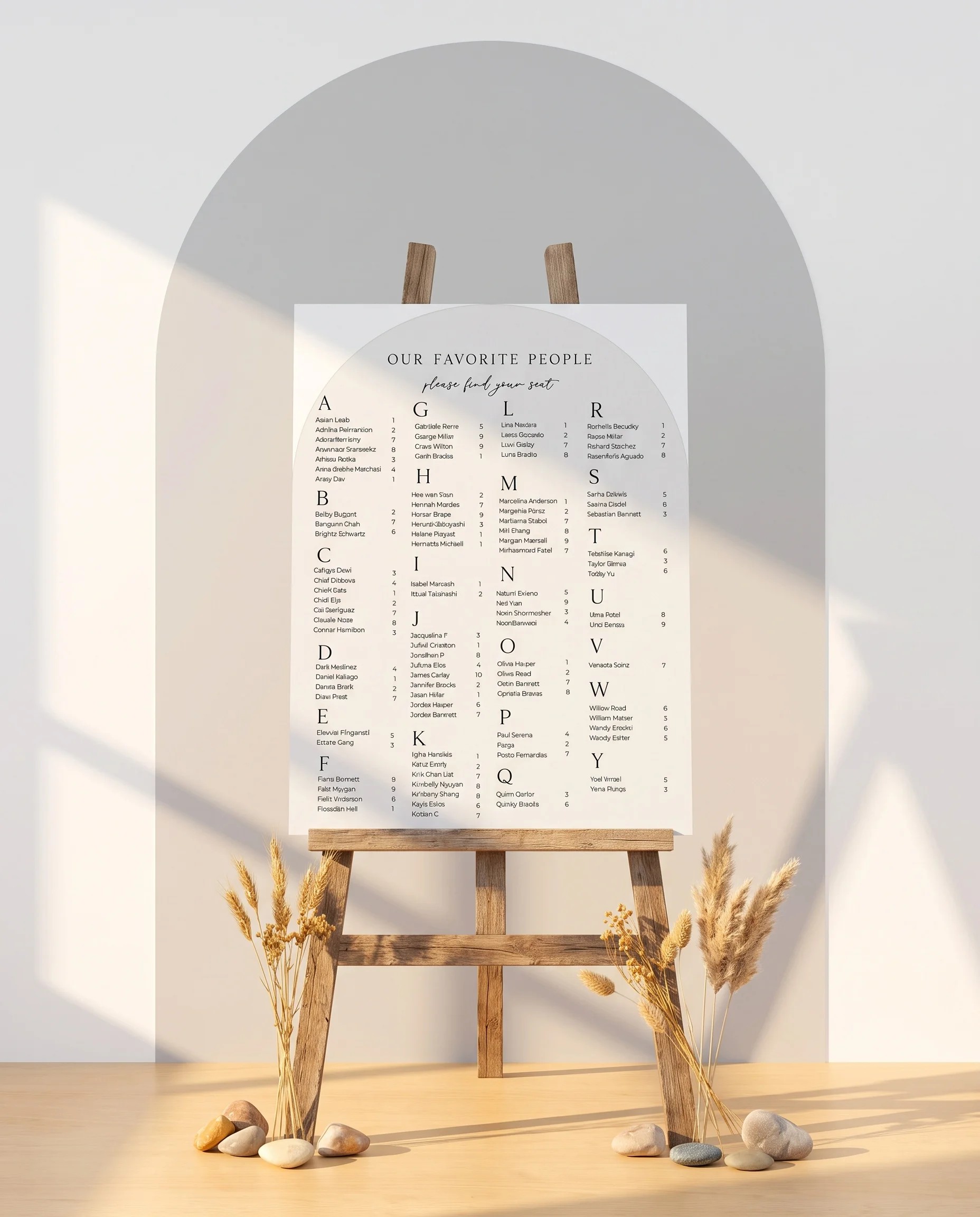 Halo Arch wedding seating chart — displayed on an easel under soft natural light with a slight overhead angle, wedding seating chart