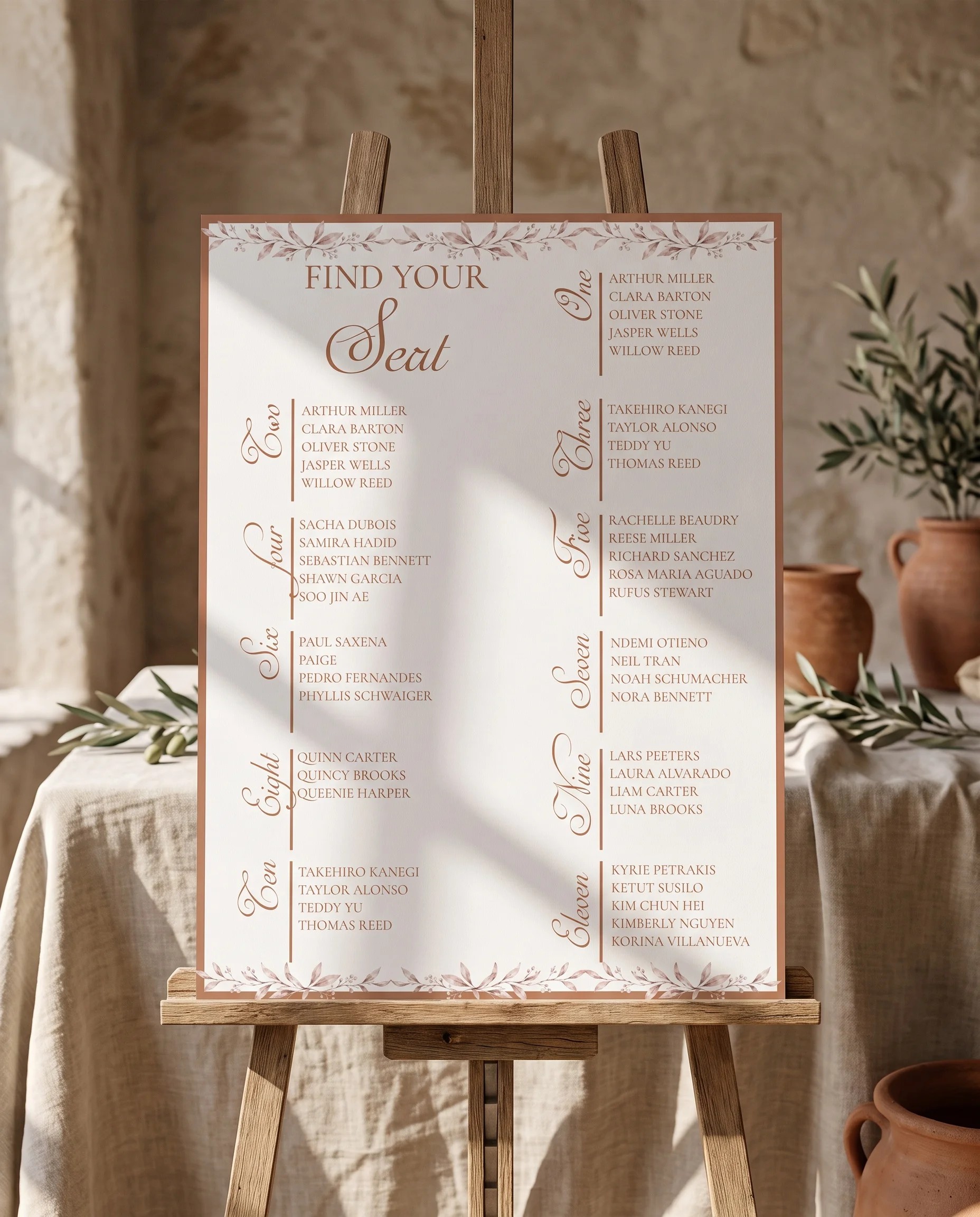 Sepia Sprig wedding seating chart — single page displayed on an easel under soft natural light, wedding seating chart.
