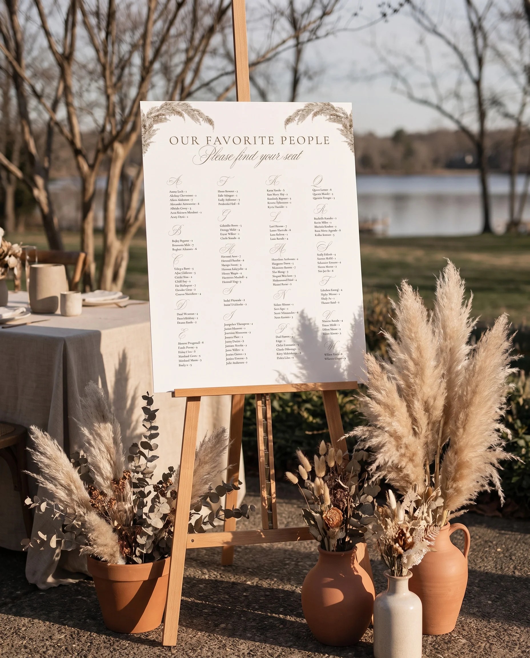 Pampas wedding seating chart — single page displayed at a reception entrance under soft natural light, seating chart template