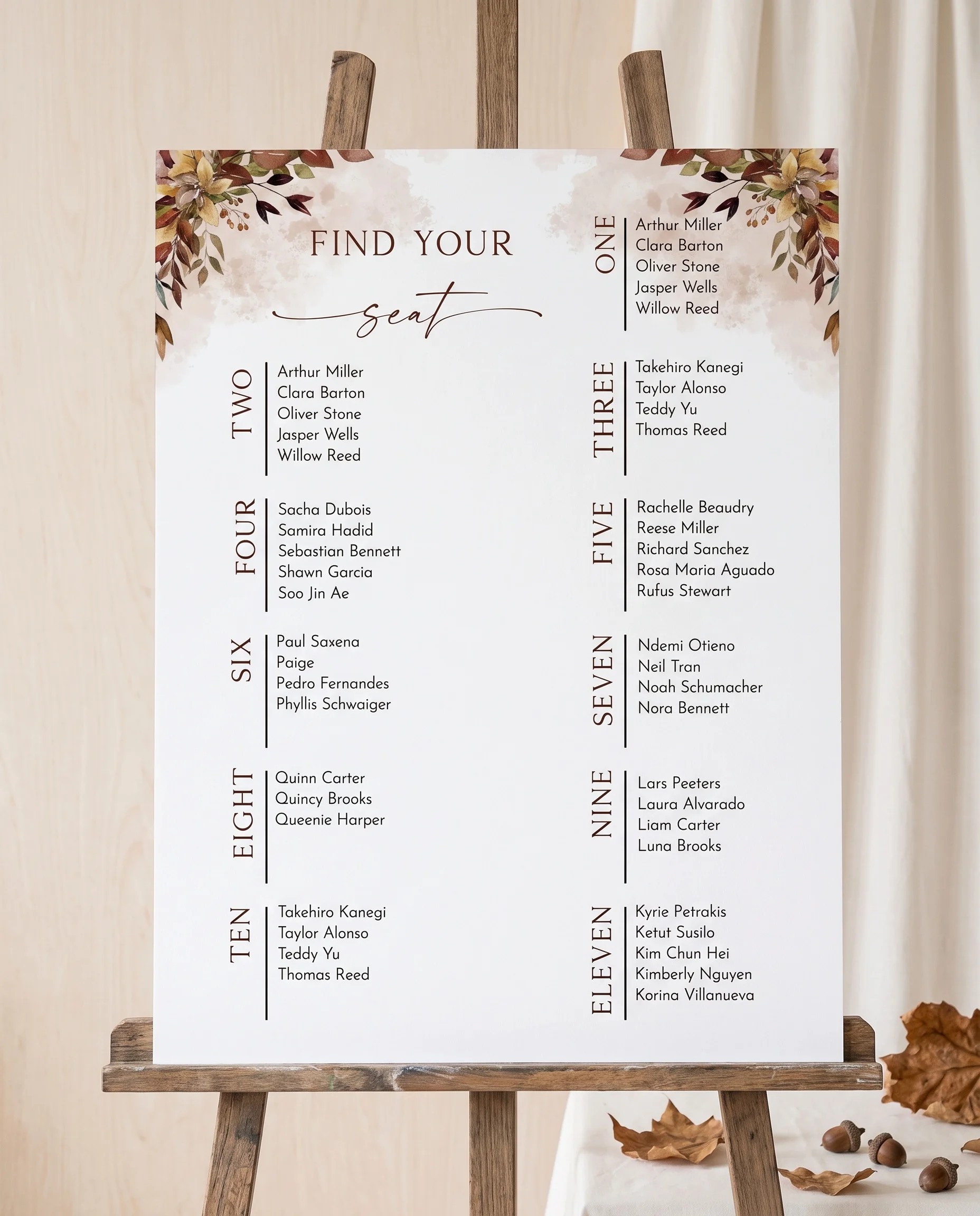 Autumn Bough wedding seating chart — displayed on an easel under soft natural light, premium editorial wedding seating chart.