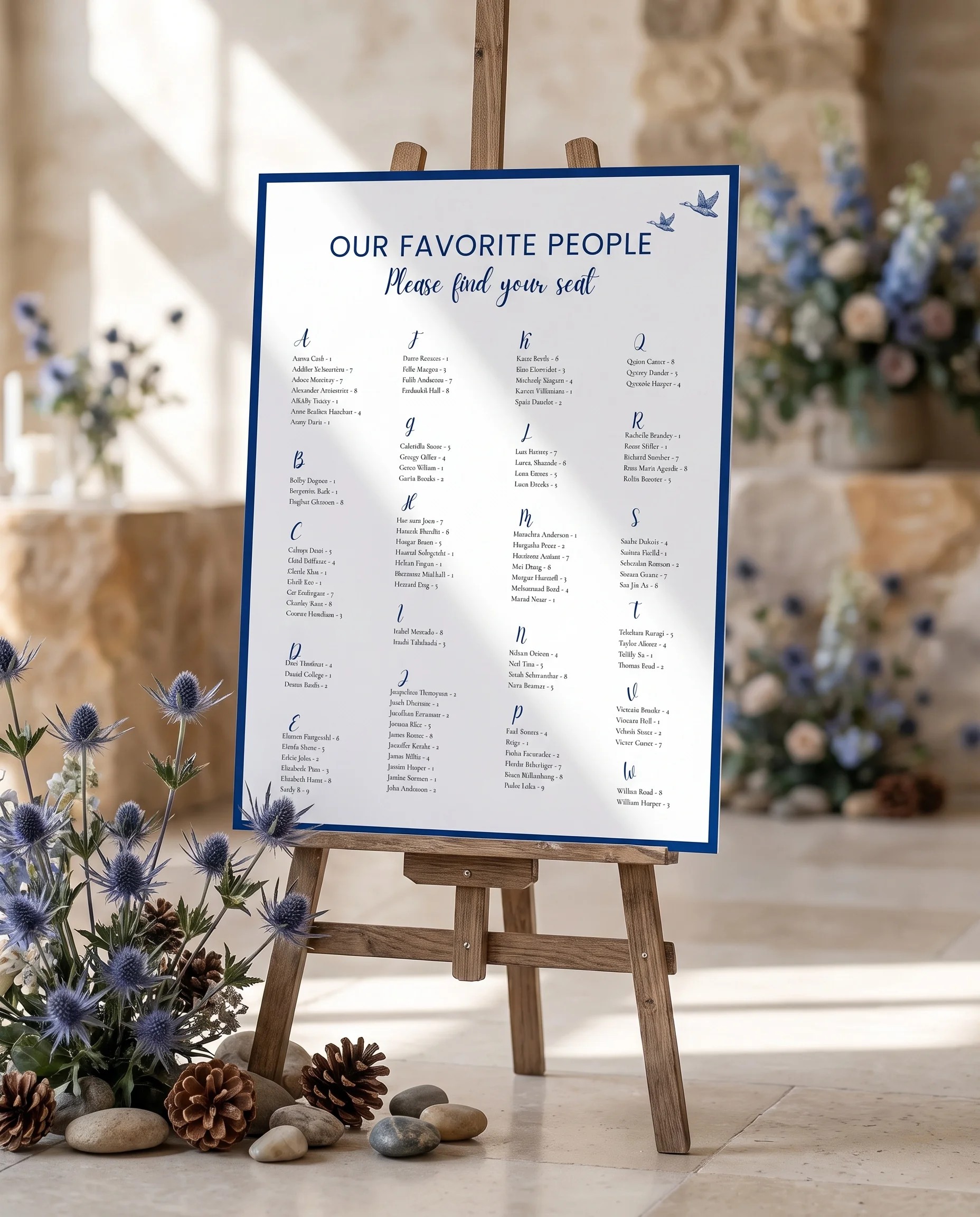 Blue Range wedding seating chart — single page displayed at a reception entrance under soft natural light, seating chart template