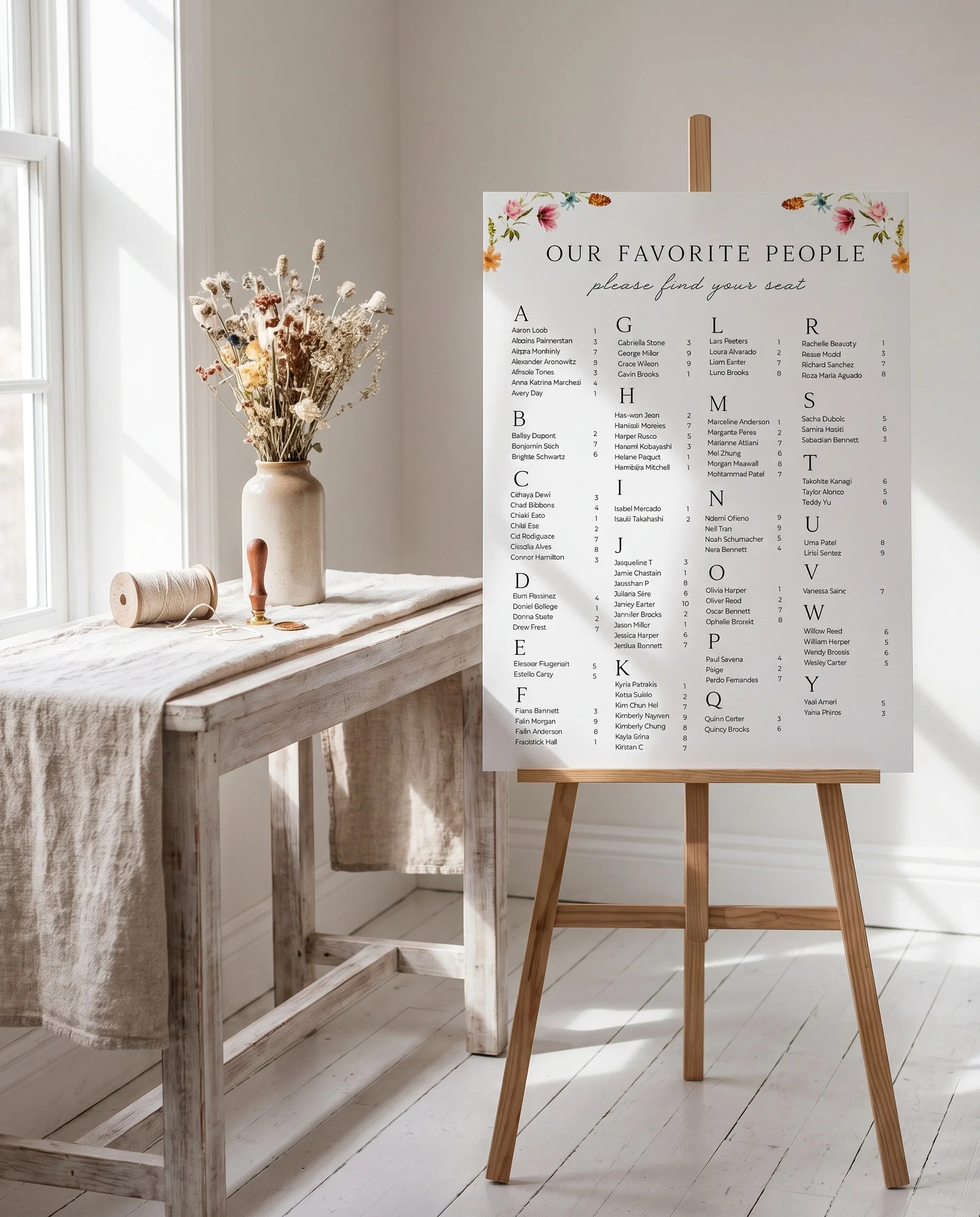 Meadow Ring wedding seating chart — single page shown beside furniture for scale under soft natural light, wedding seating chart template