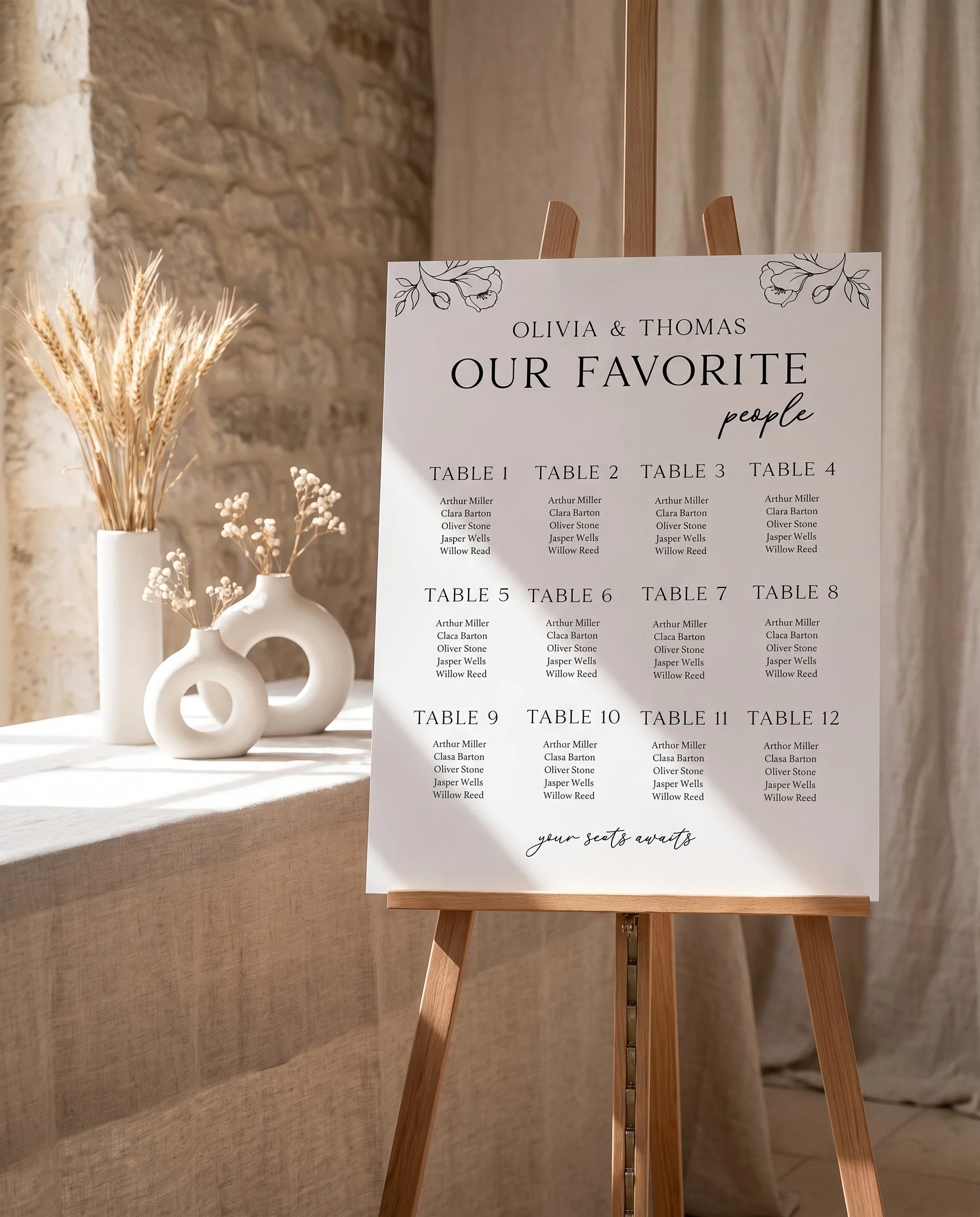 Meadow Sprig wedding seating chart — single page shown beside furniture for scale under soft overhead light, wedding seating chart template