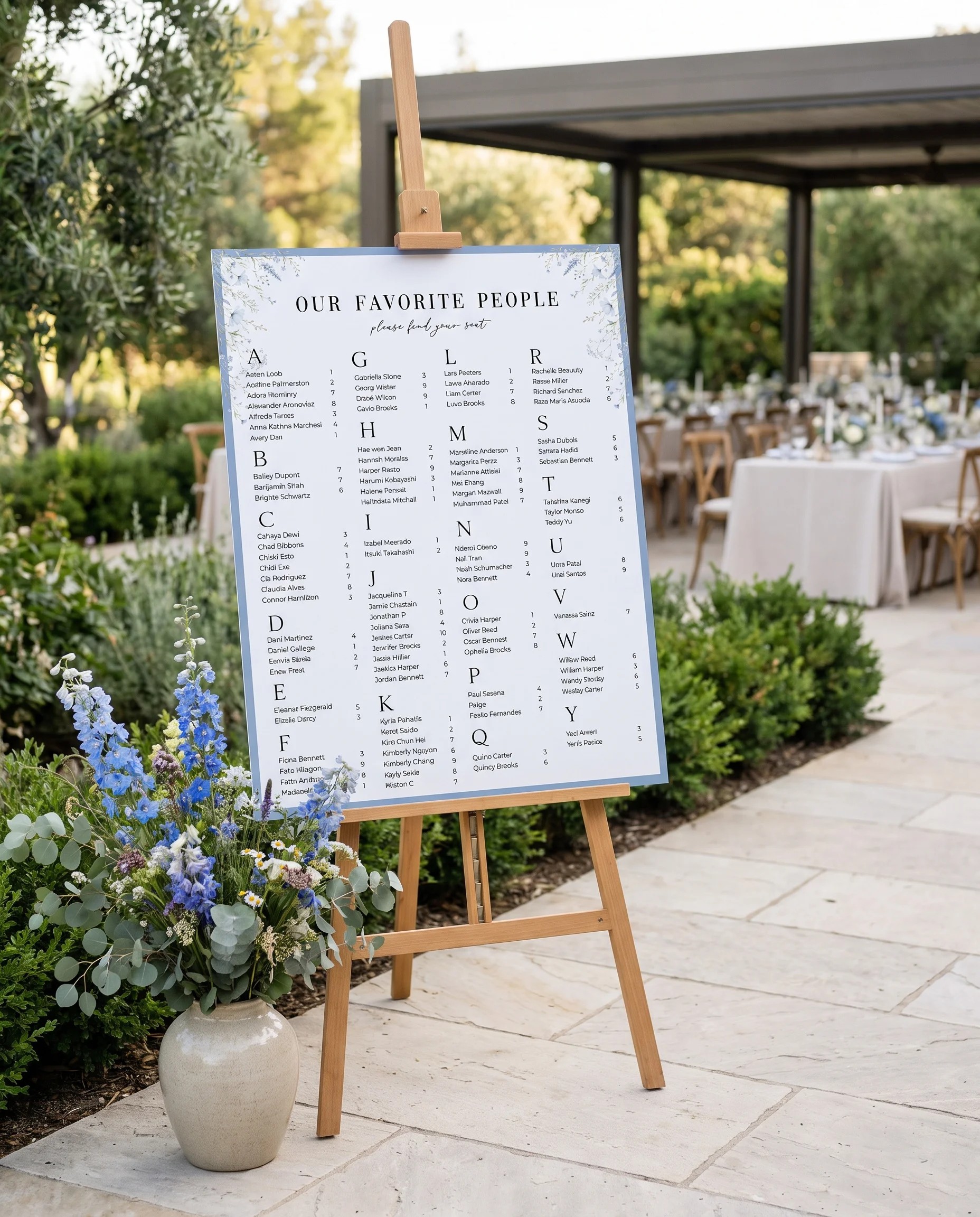 Azure Sprig wedding seating chart — single page displayed at a reception entrance under soft natural light, seating chart template