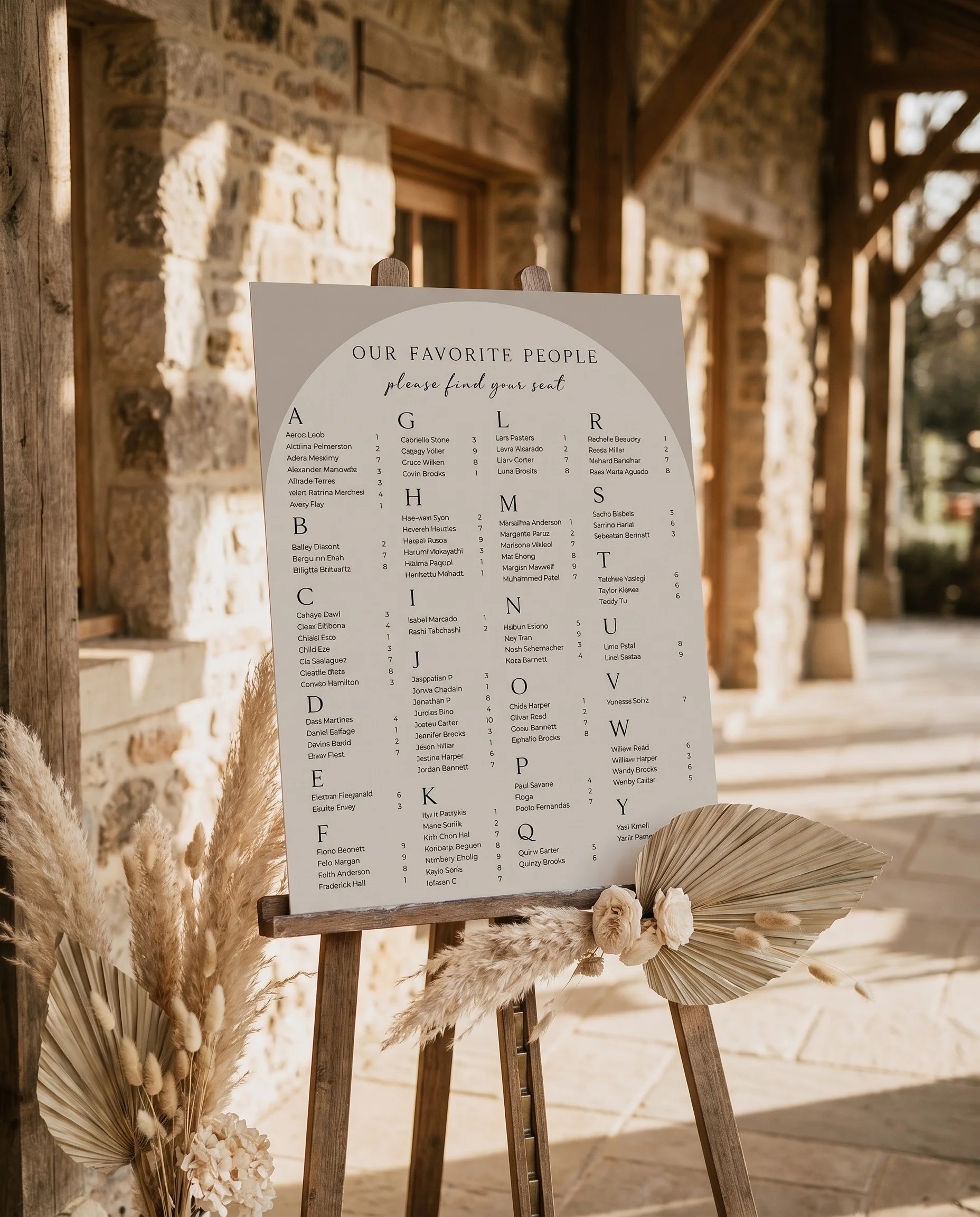 Tassel Arc wedding seating chart — displayed at a reception entrance under soft natural light with a slight overhead angle, seating chart template