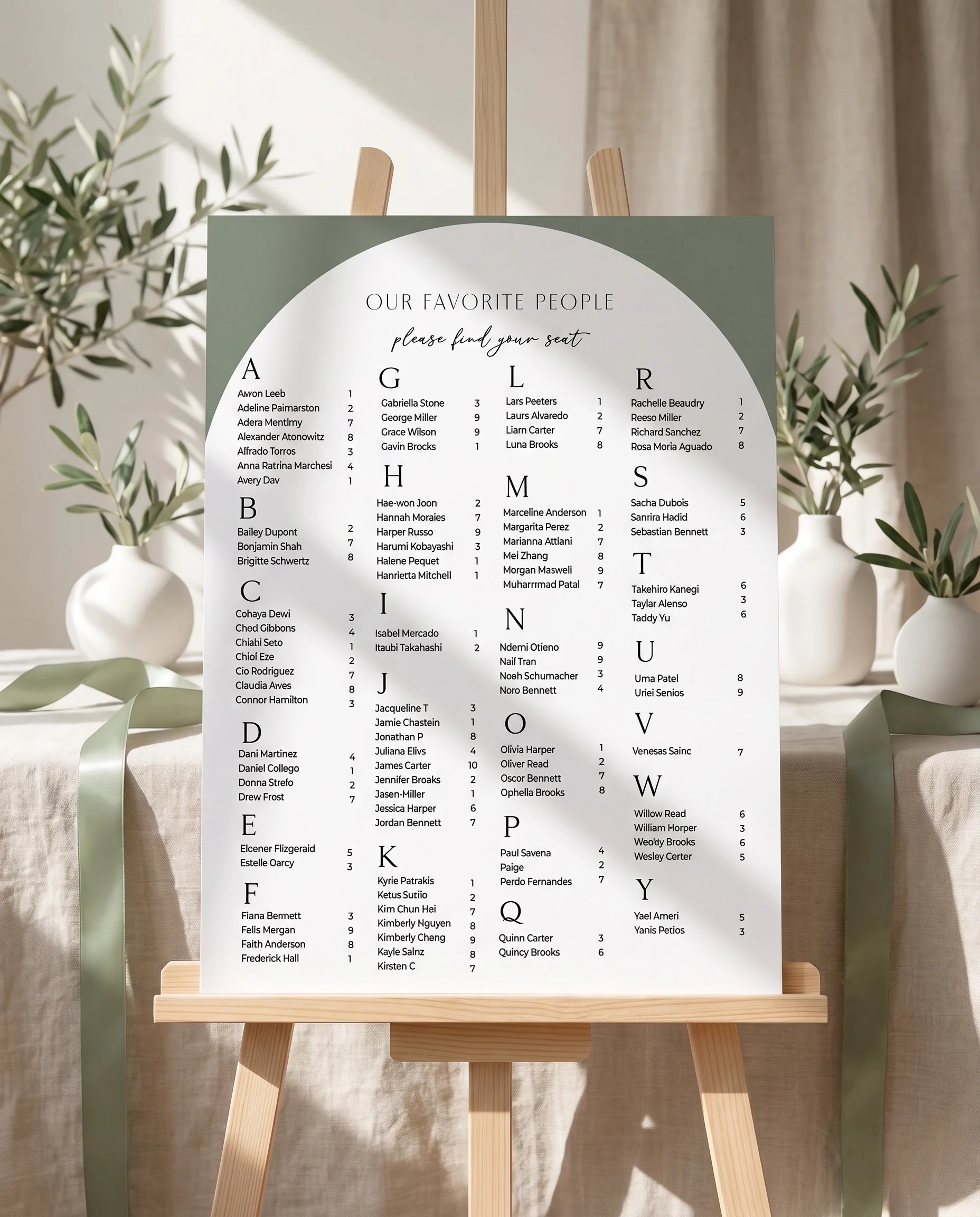 Arc Vale wedding seating chart — displayed on an easel under soft natural light with a slight overhead angle, wedding seating chart