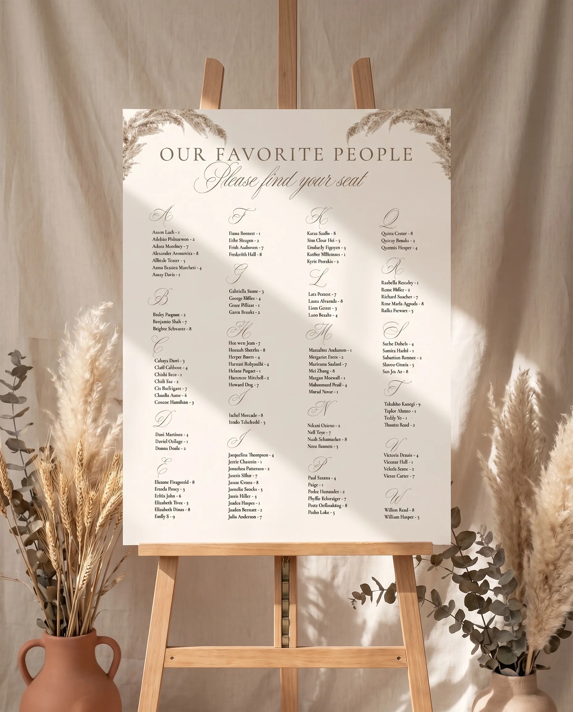 Pampas wedding seating chart — single page displayed on an easel under soft natural light, wedding seating chart