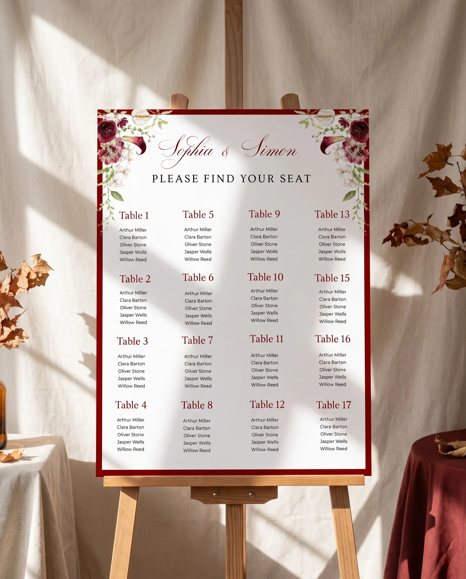 Burgundy Calla wedding seating chart — displayed on an easel under soft natural light at a slight overhead angle, wedding seating chart.