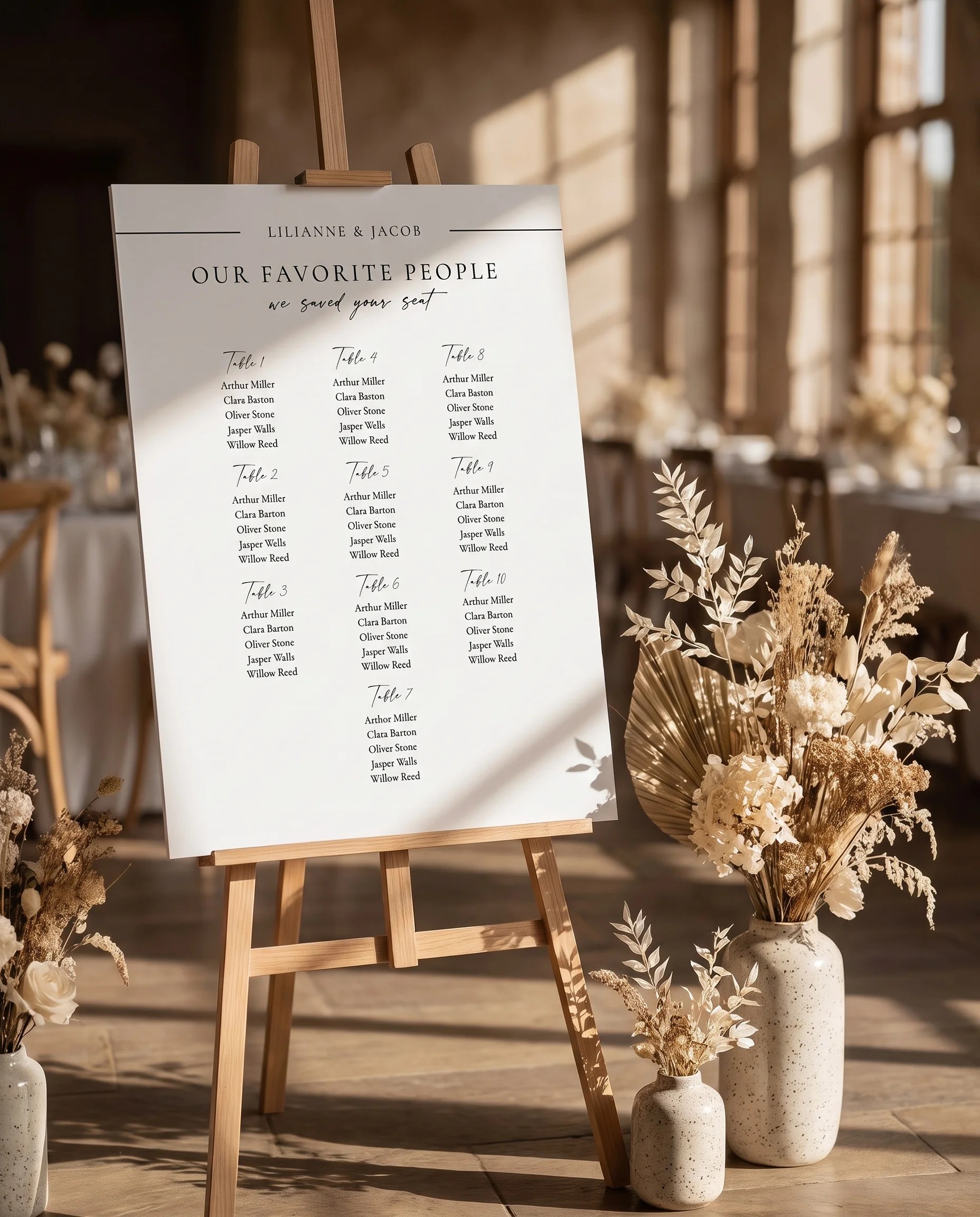 Tonal Reply wedding seating chart — single page displayed at a reception entrance under soft natural light, seating chart template