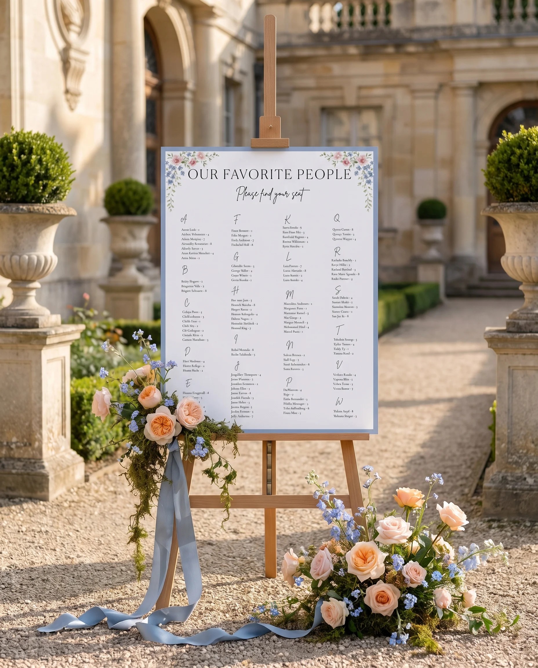 Meadow Spire wedding seating chart — displayed on an easel under soft natural light with a slight overhead angle, wedding seating chart.