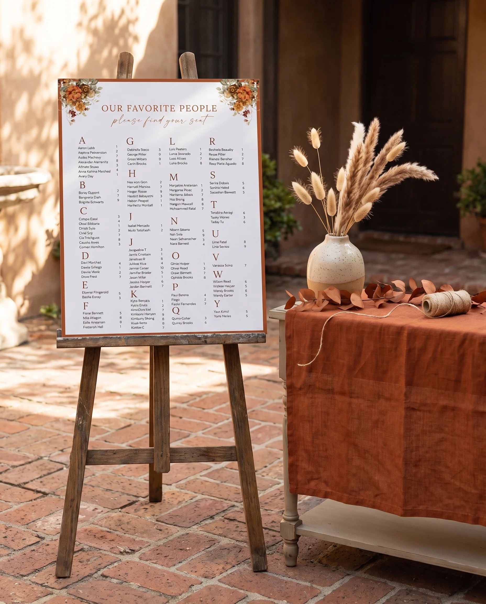 Terracotta Crown wedding seating chart — shown beside furniture for scale under soft natural light, wedding seating chart template.
